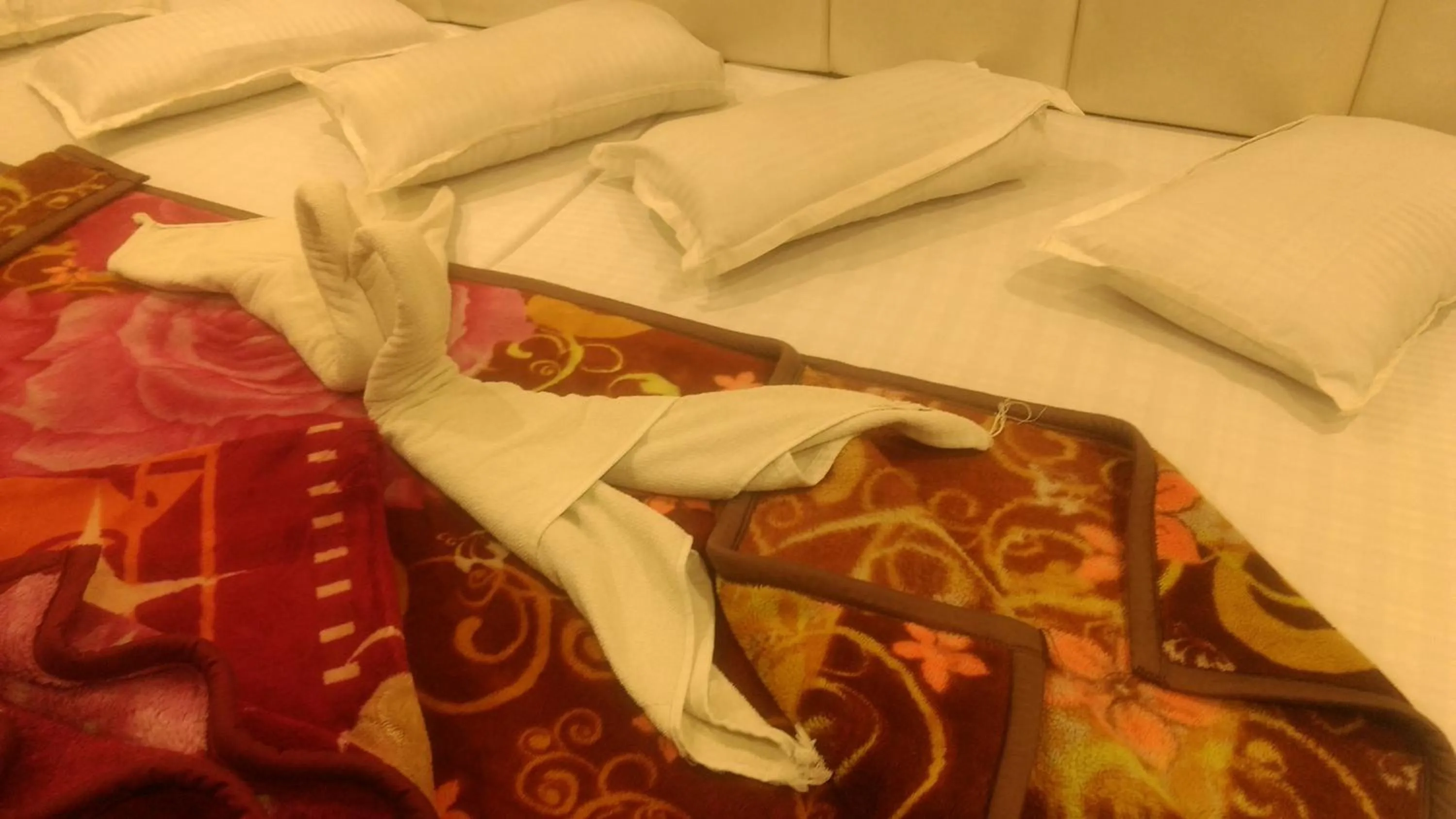 Bed in Ashiyana Inn Hotel