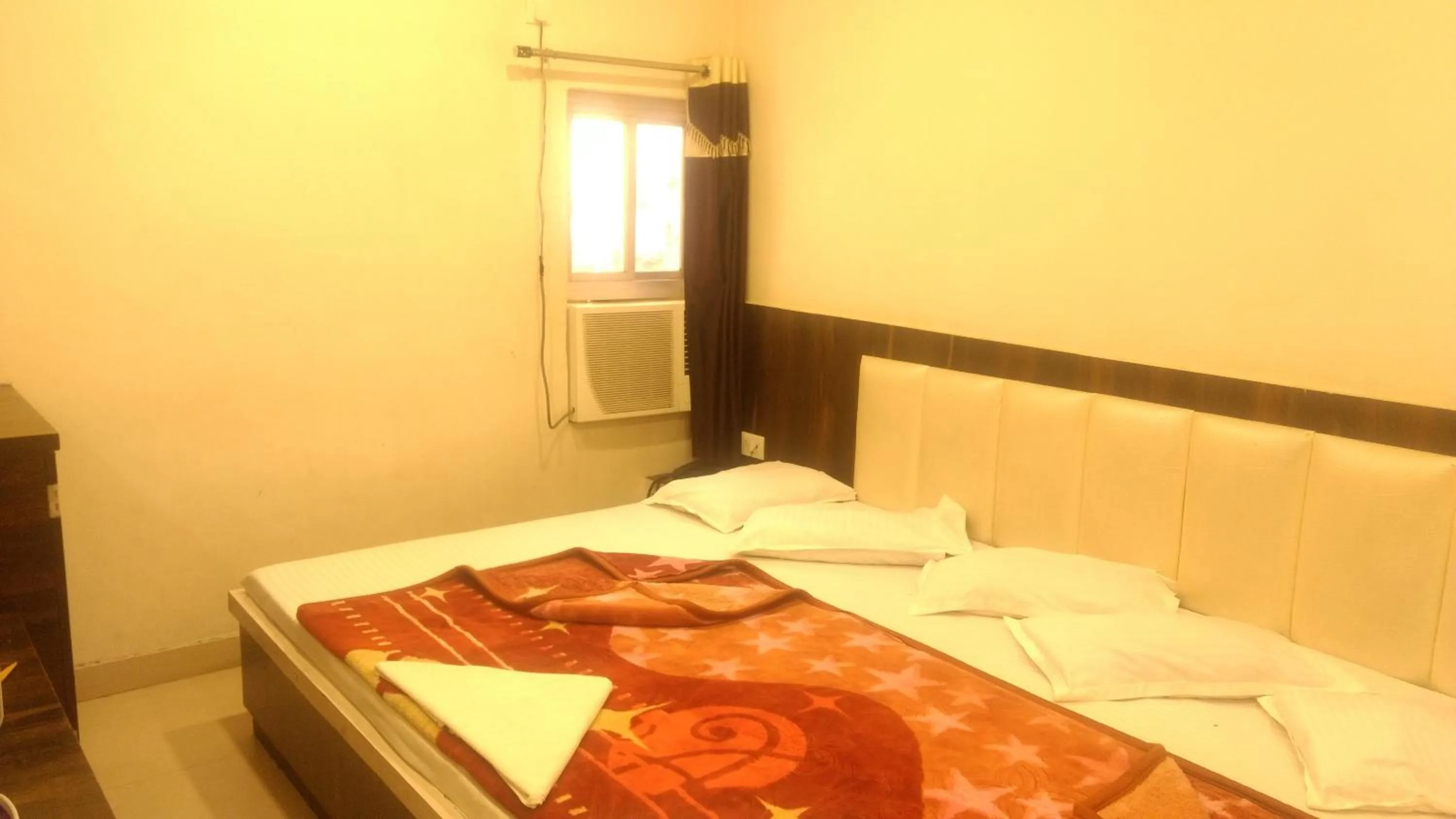 Bed in Ashiyana Inn Hotel