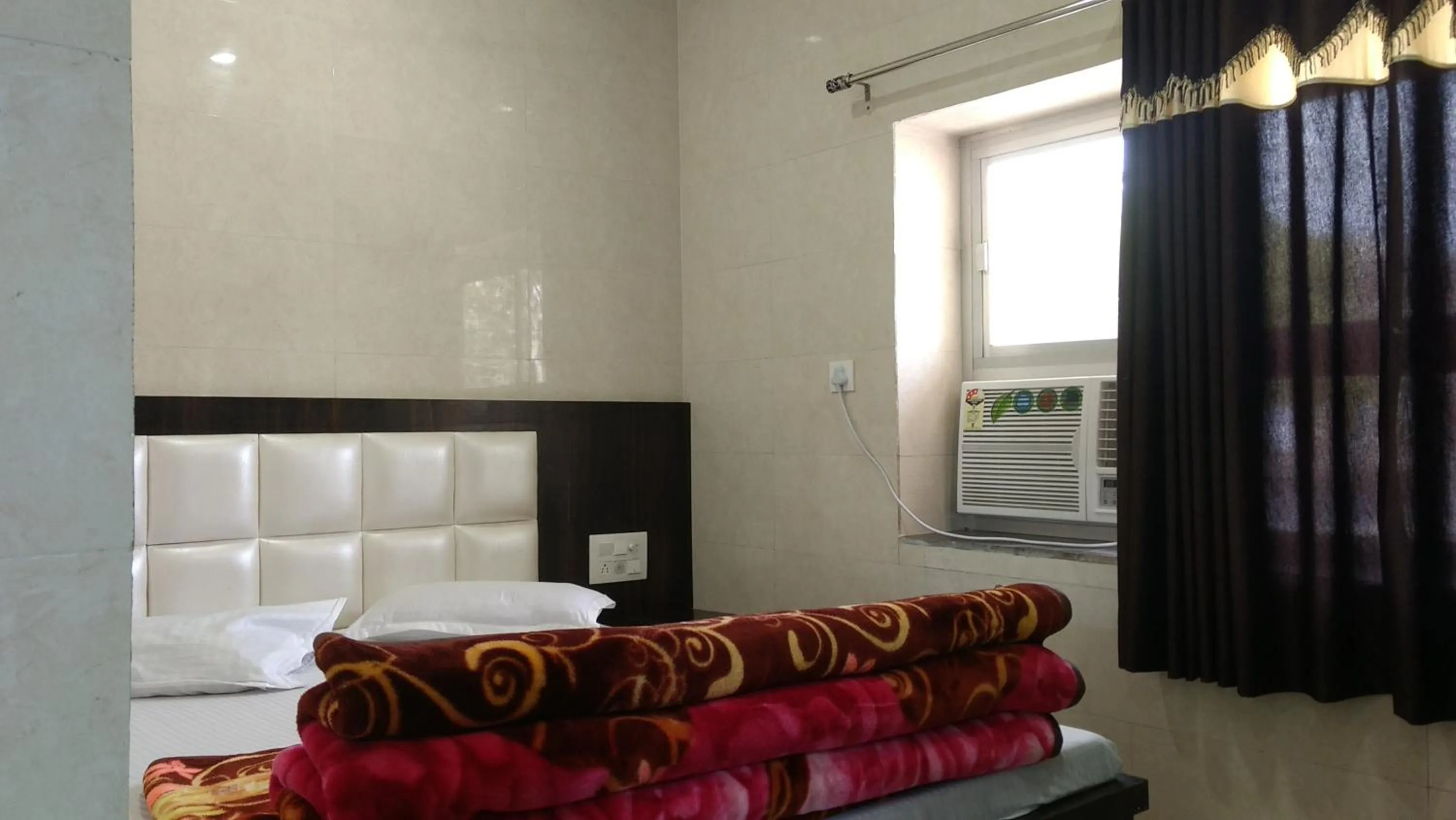 Bed in Ashiyana Inn Hotel