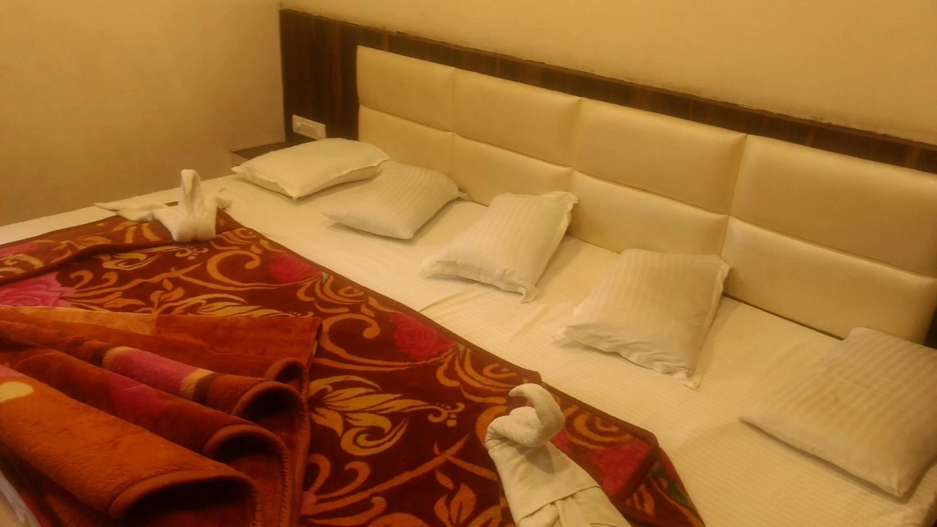 Bed in Ashiyana Inn Hotel