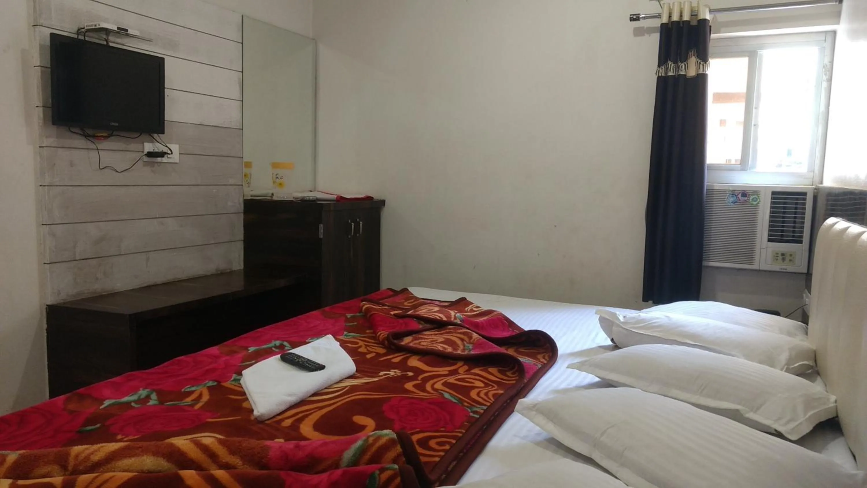 Bed in Ashiyana Inn Hotel