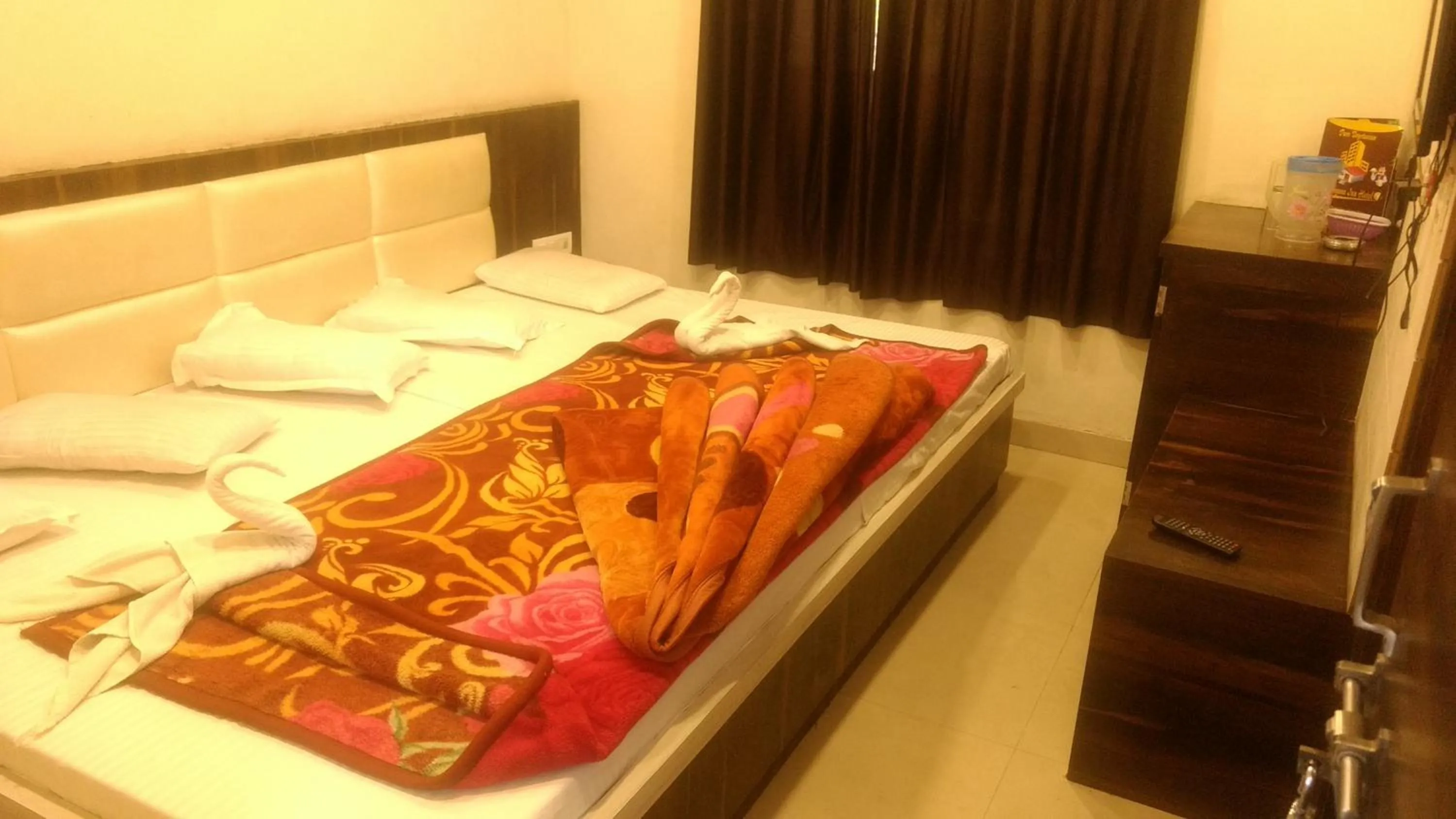 Bed in Ashiyana Inn Hotel