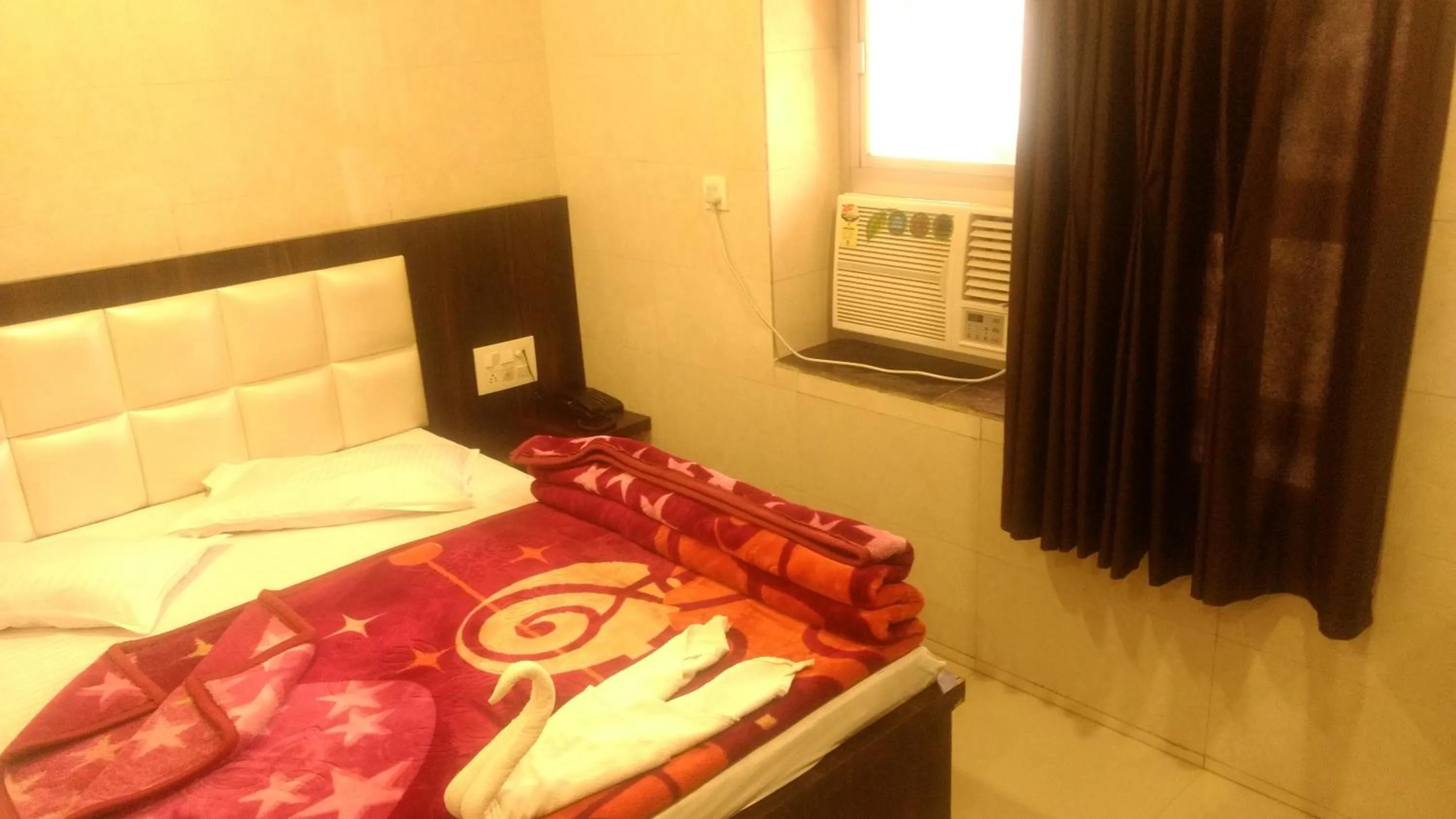 Bed in Ashiyana Inn Hotel