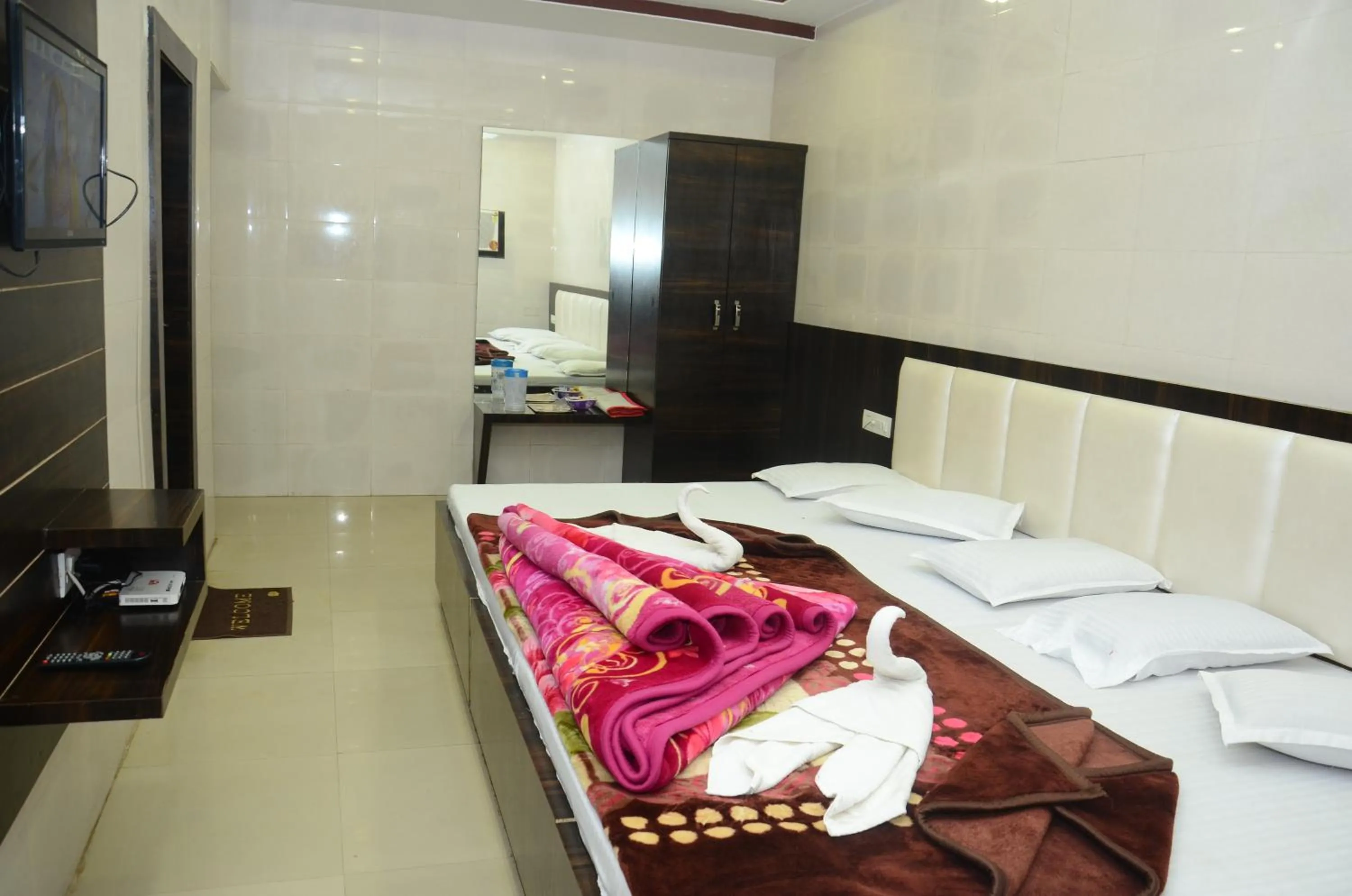 Bed in Ashiyana Inn Hotel