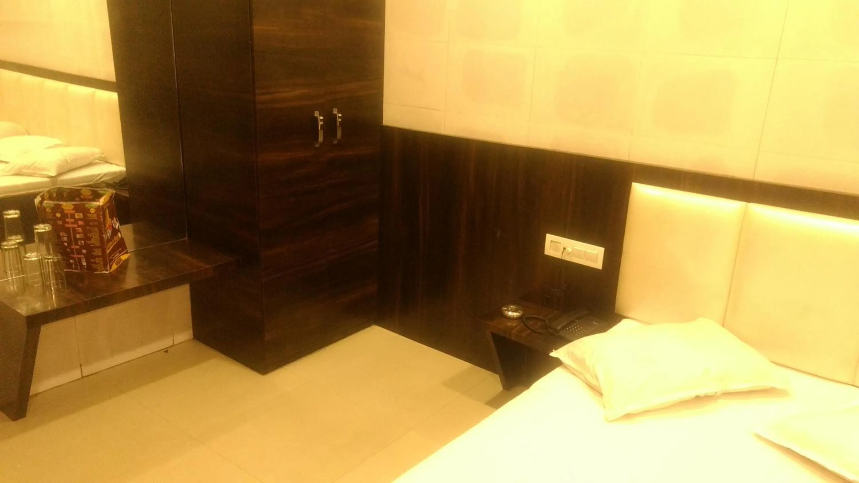 Bed in Ashiyana Inn Hotel