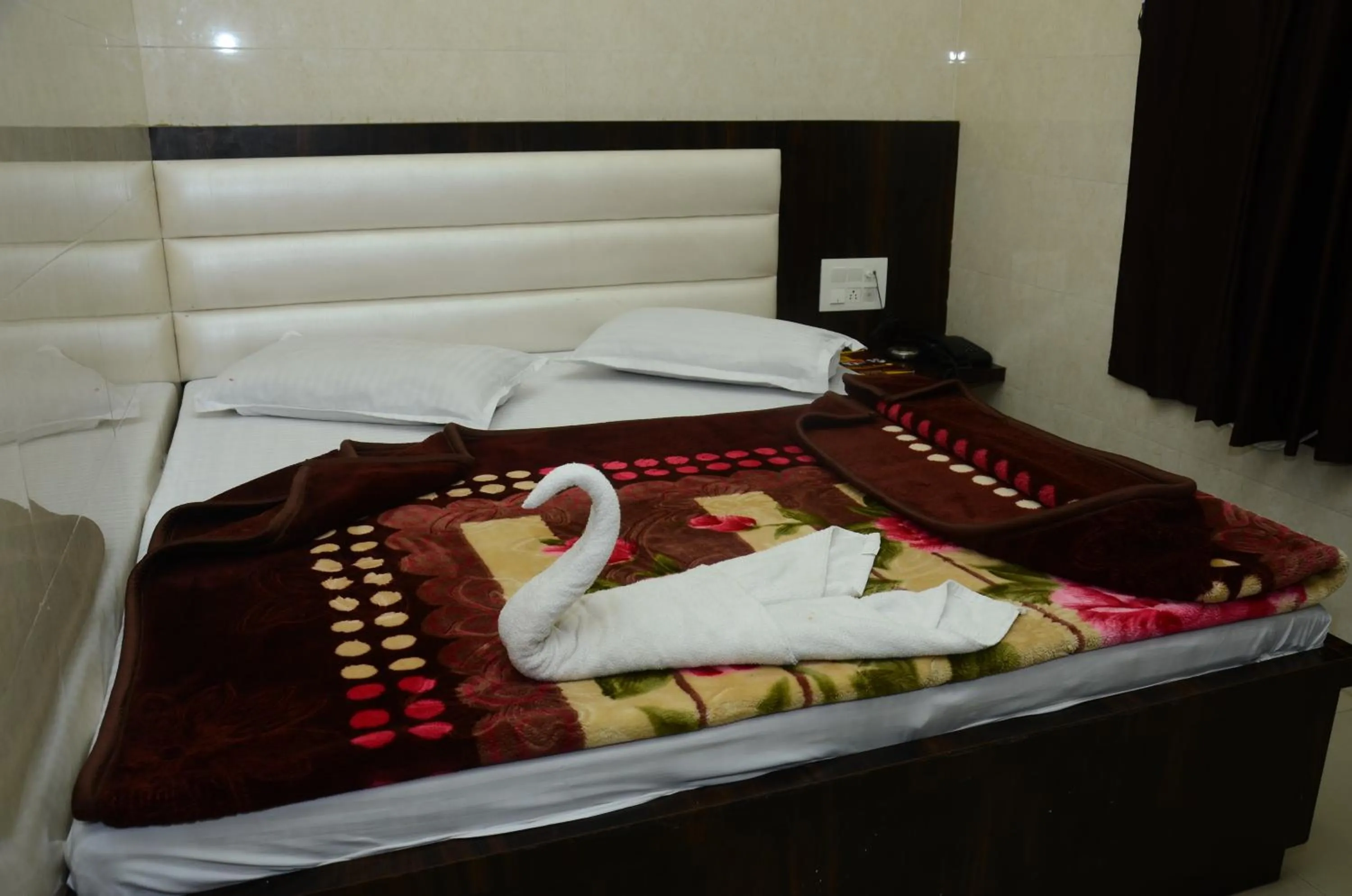 Bed in Ashiyana Inn Hotel