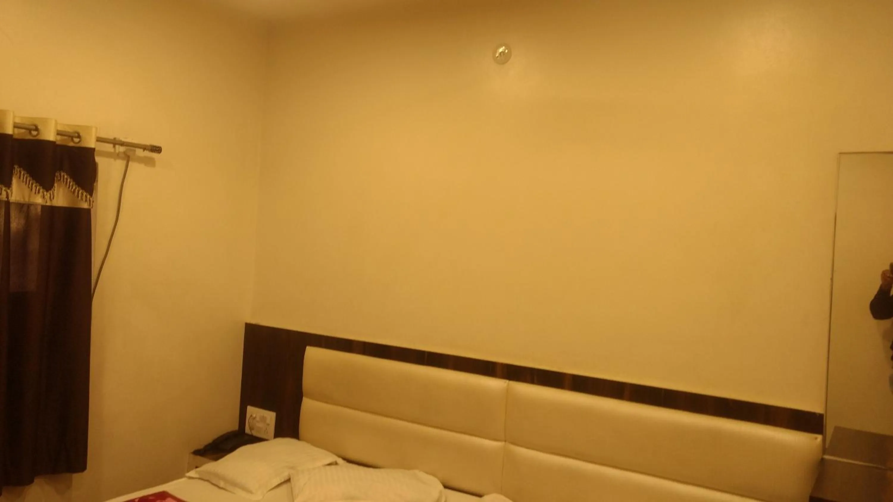 Bed in Ashiyana Inn Hotel