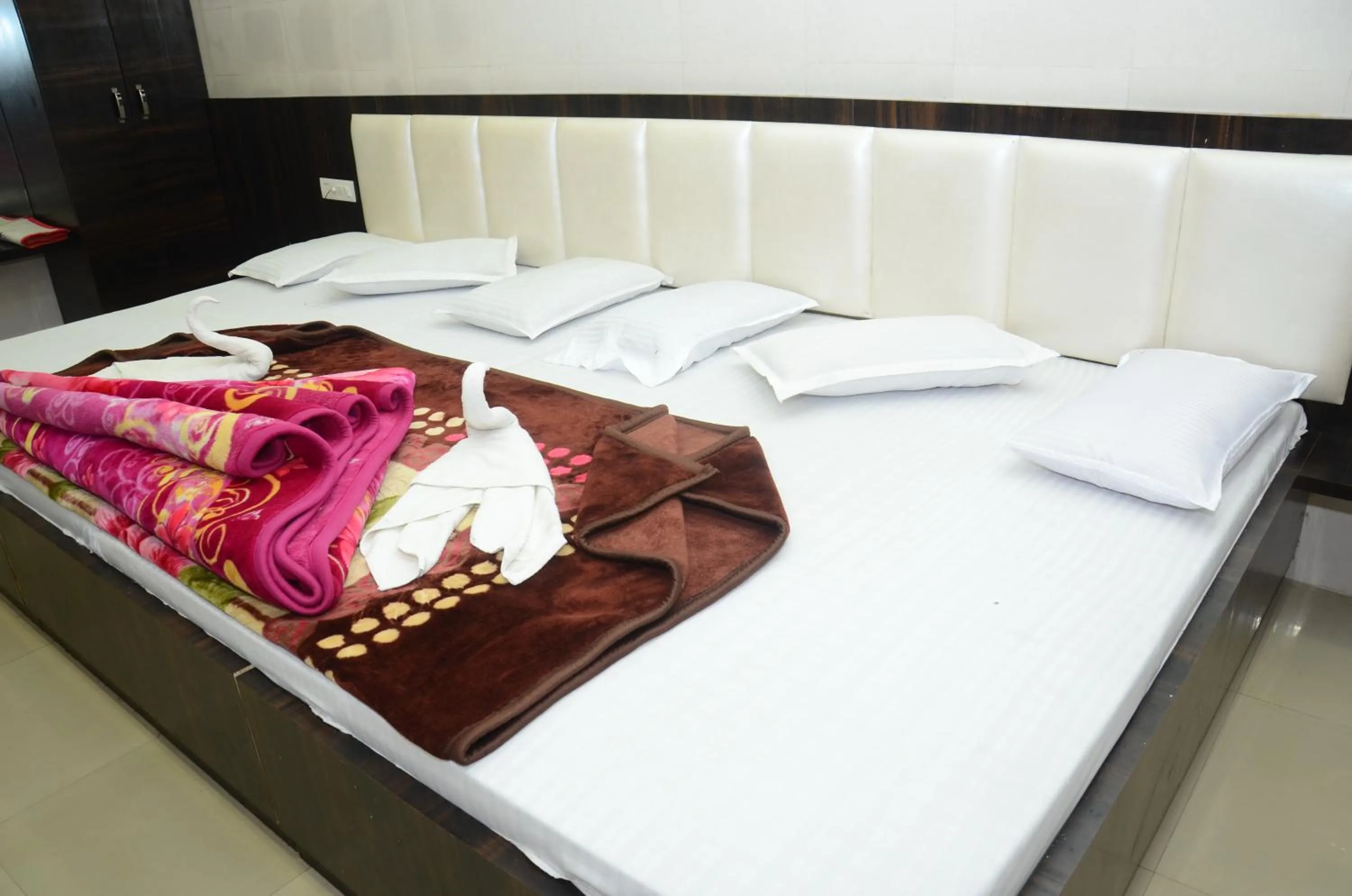 Bed in Ashiyana Inn Hotel