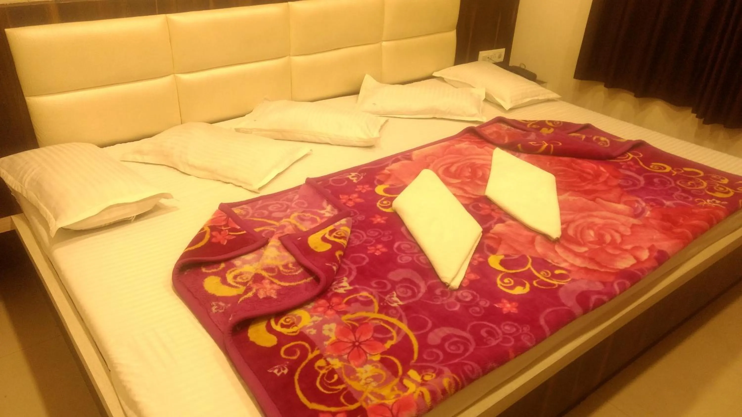 Bed in Ashiyana Inn Hotel