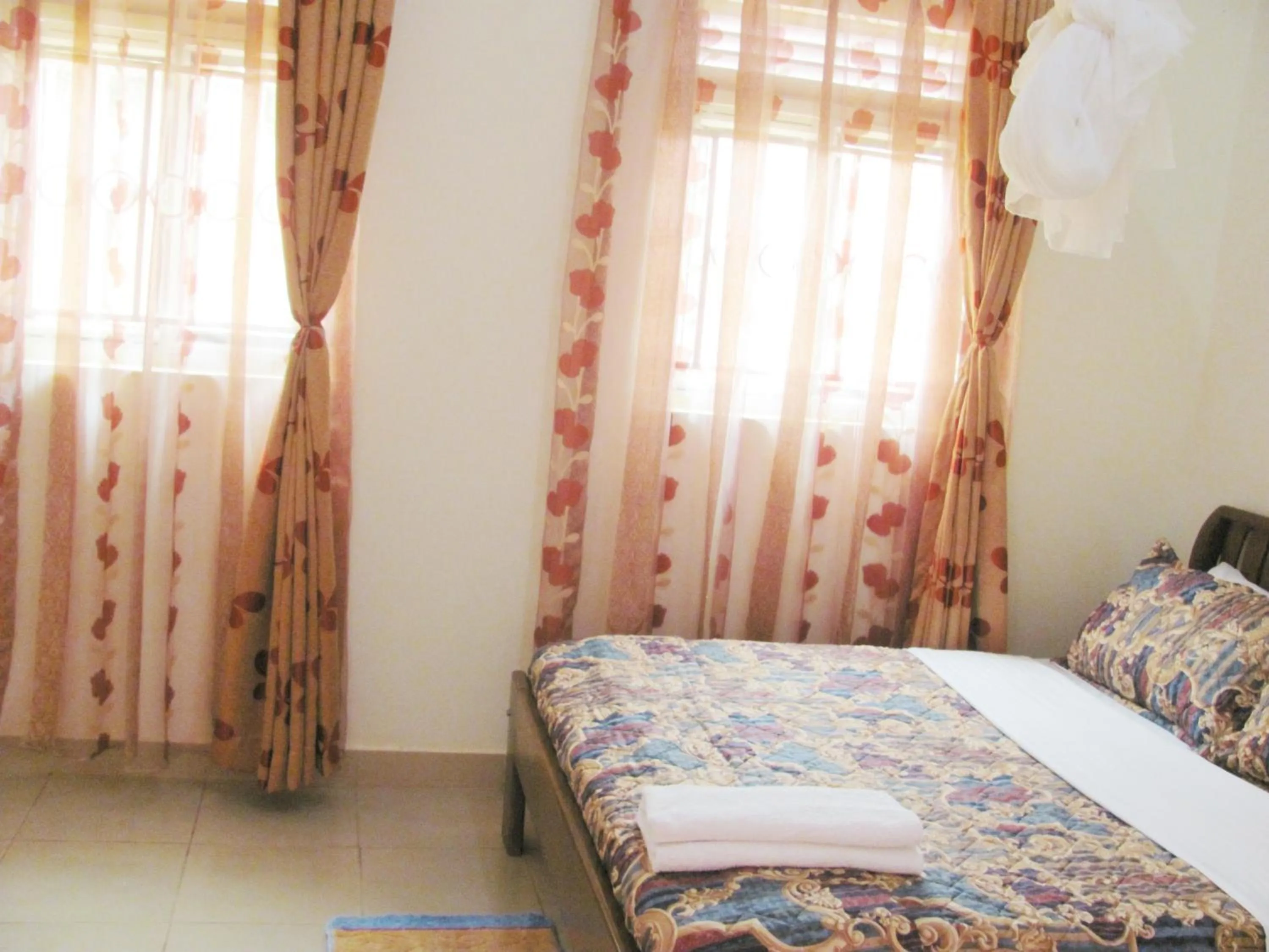 Bed in Sadrina Comfort Cottages Kyanja Kampala