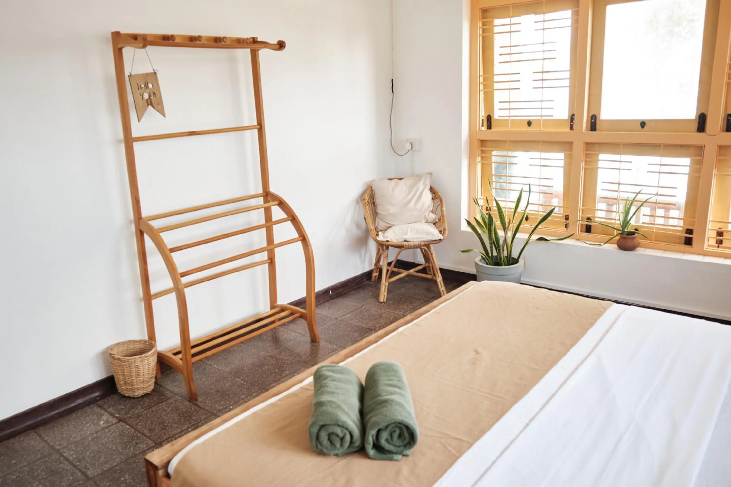 Bed in Basecamp Yoga Beach House