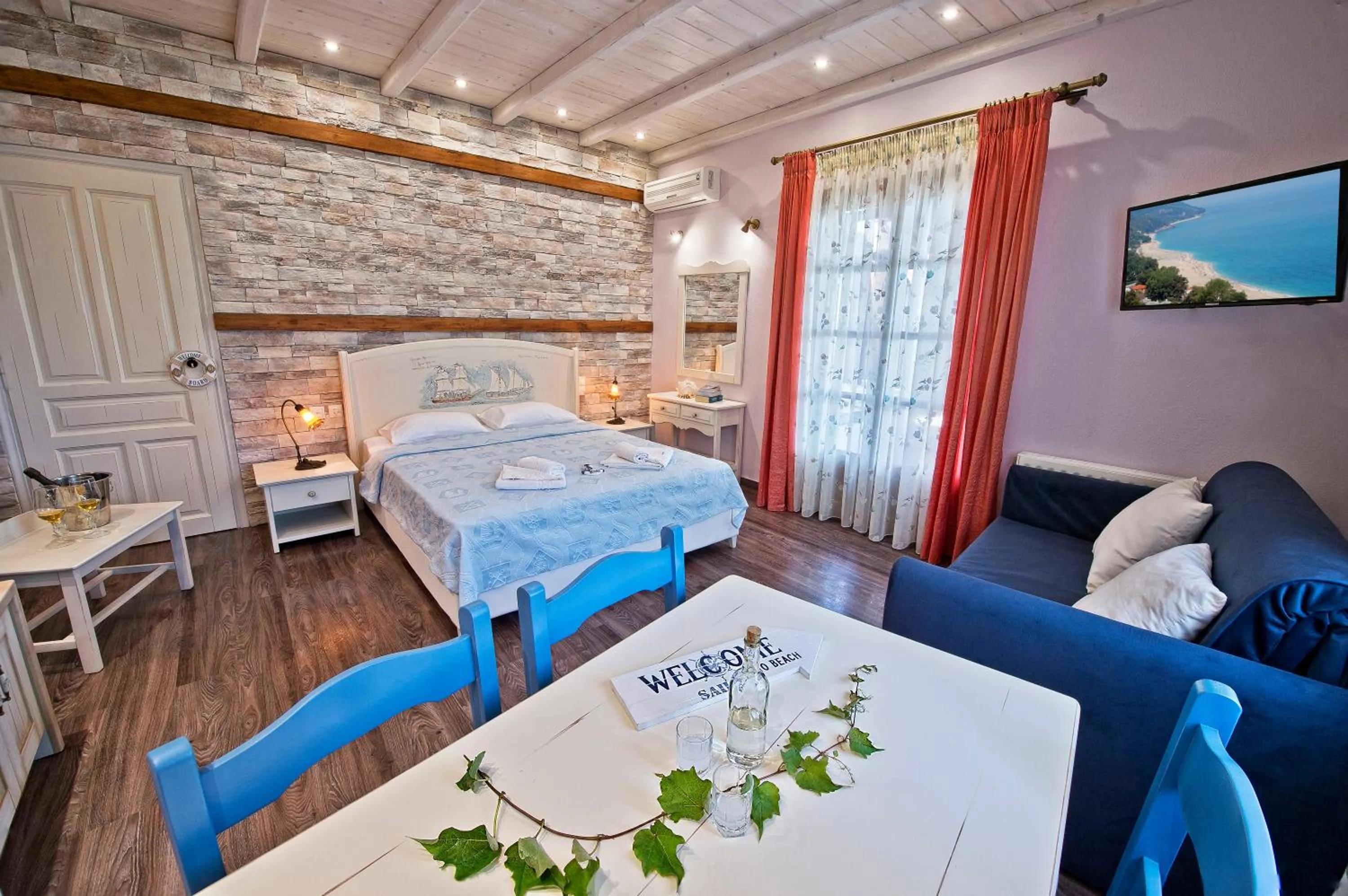 Photo of the whole room, Bed in Flamingo Hotel Pelion - Seaside Superior Studios & Suites