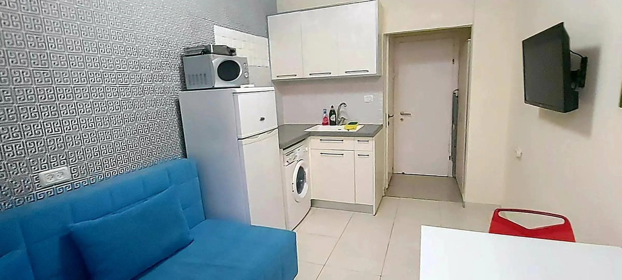 TV and multimedia in Beachfront Studio Apartment Bat Yam 412