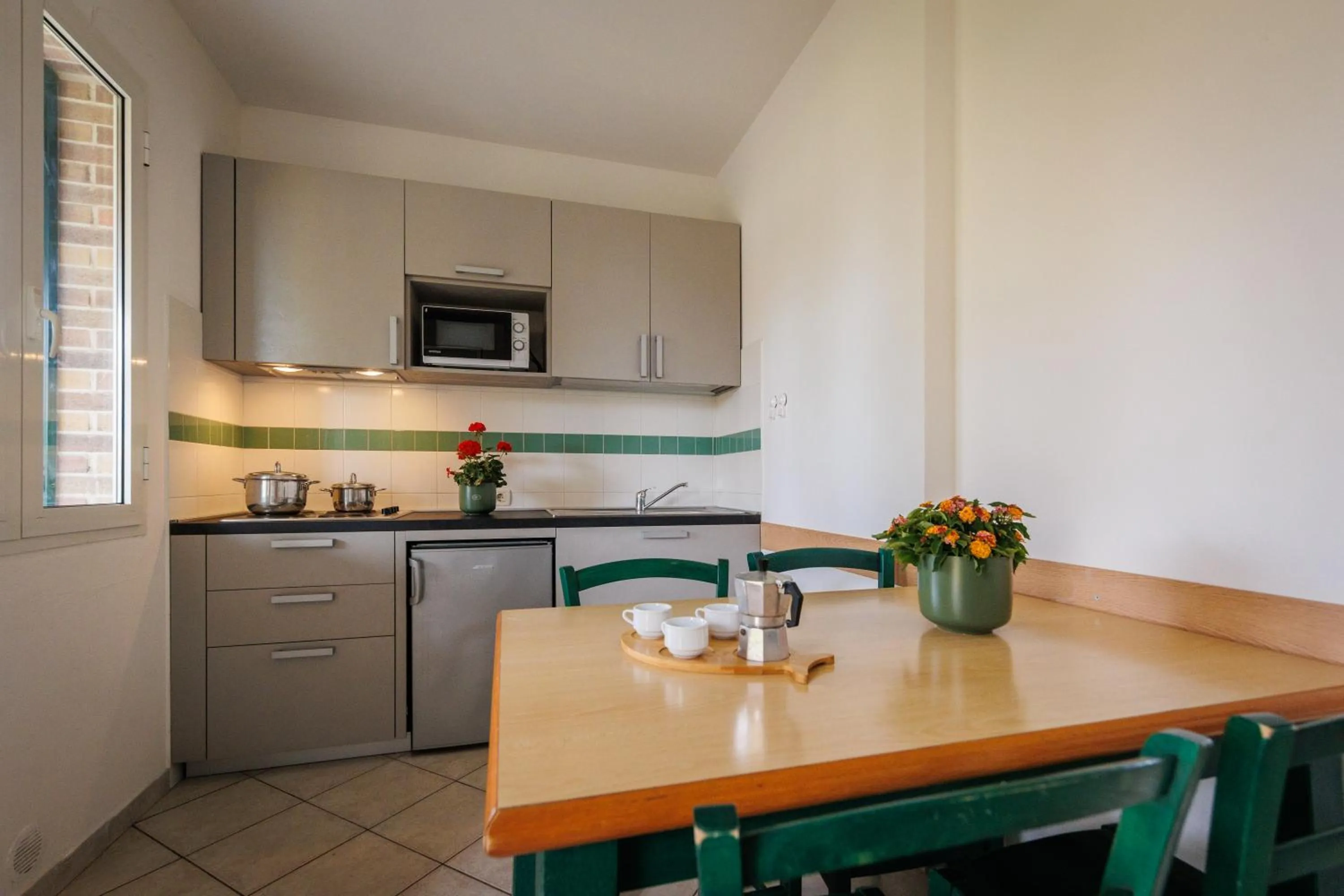 Kitchen or kitchenette in Villaggio Turistico La Cecinella