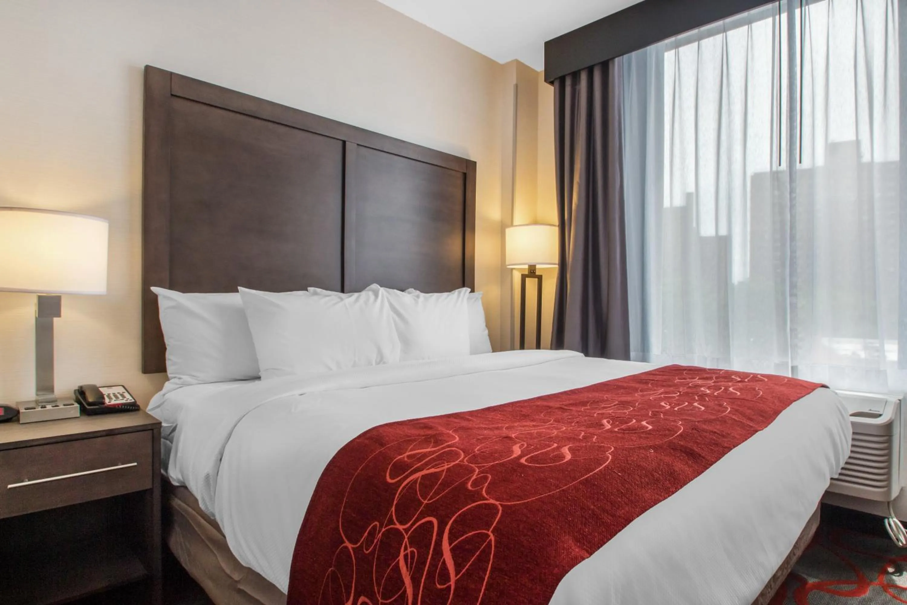 Bed in Comfort Inn & Suites near Stadium