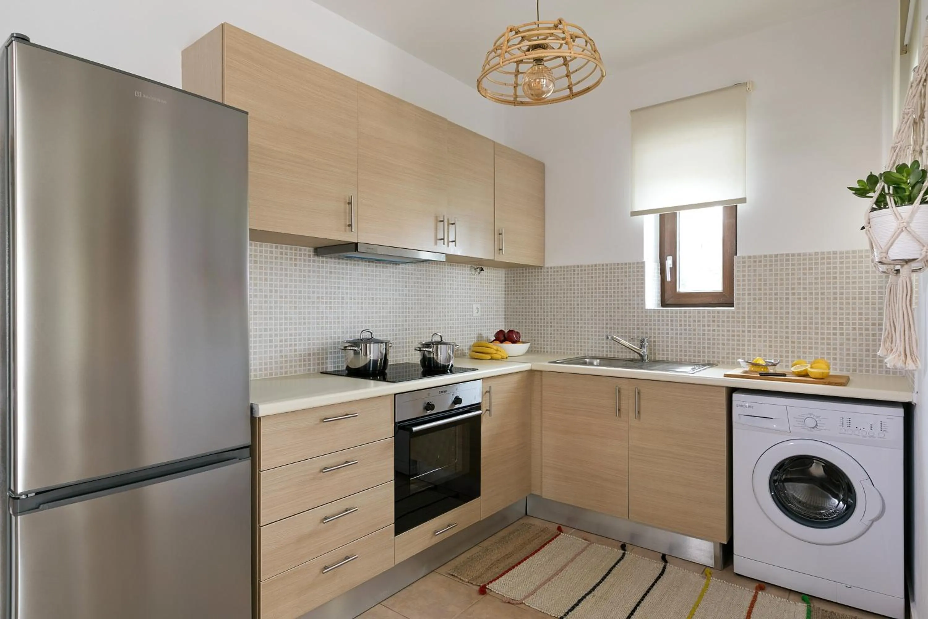 Kitchen or kitchenette in Syra Suites