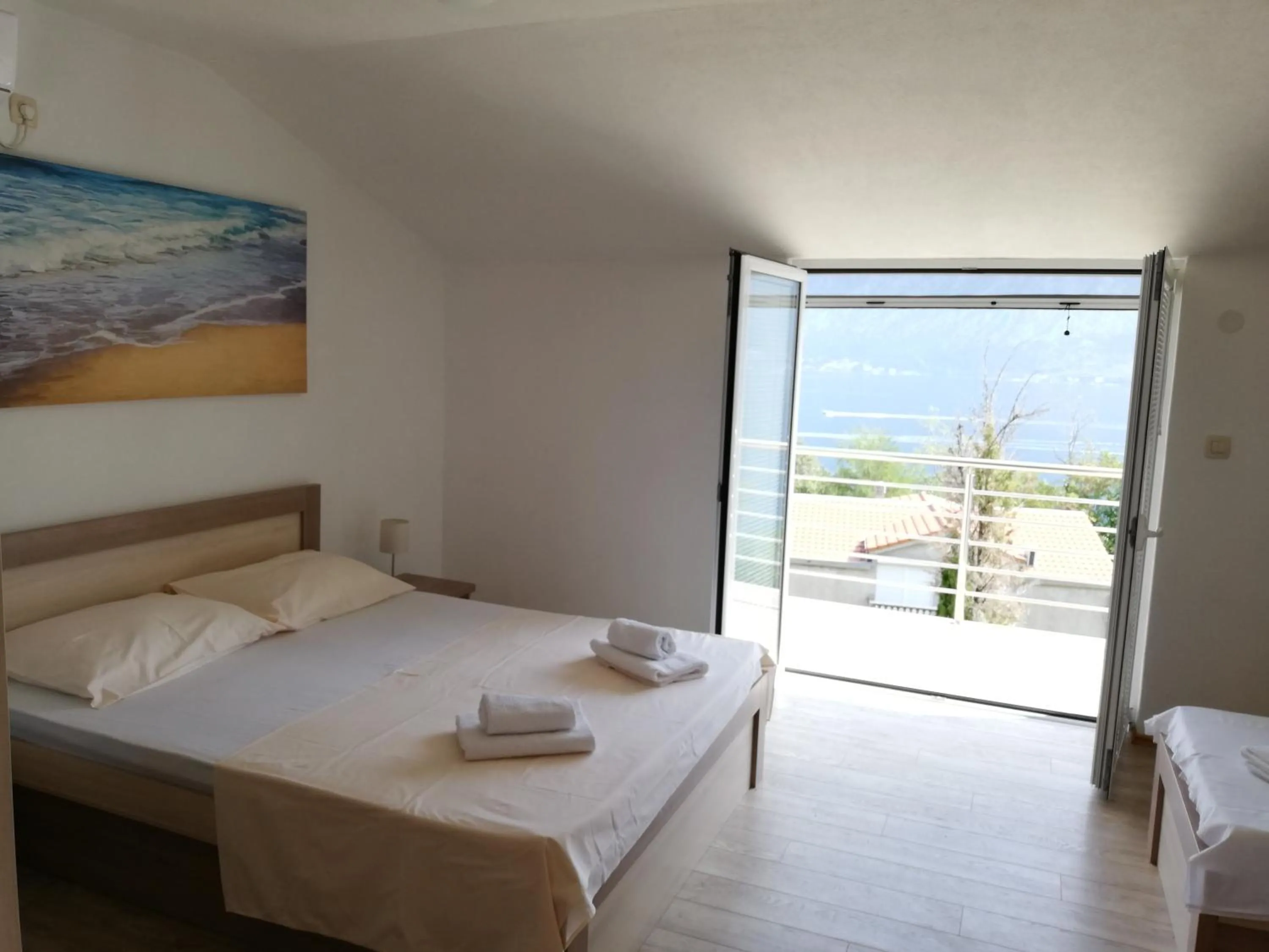 Bed in Ruža Apartments Sea View