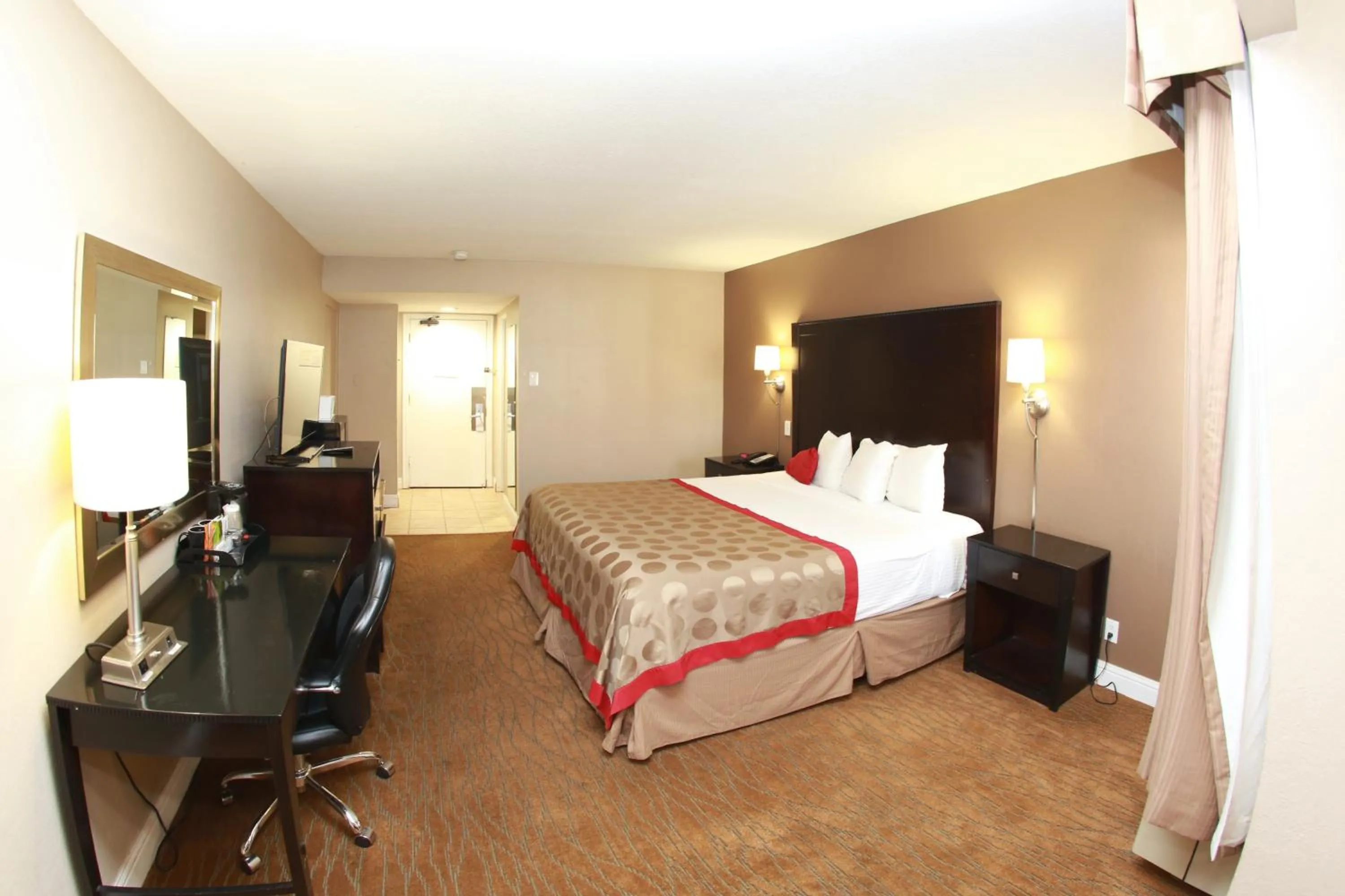 Bed in Ramada by Wyndham Fresno North