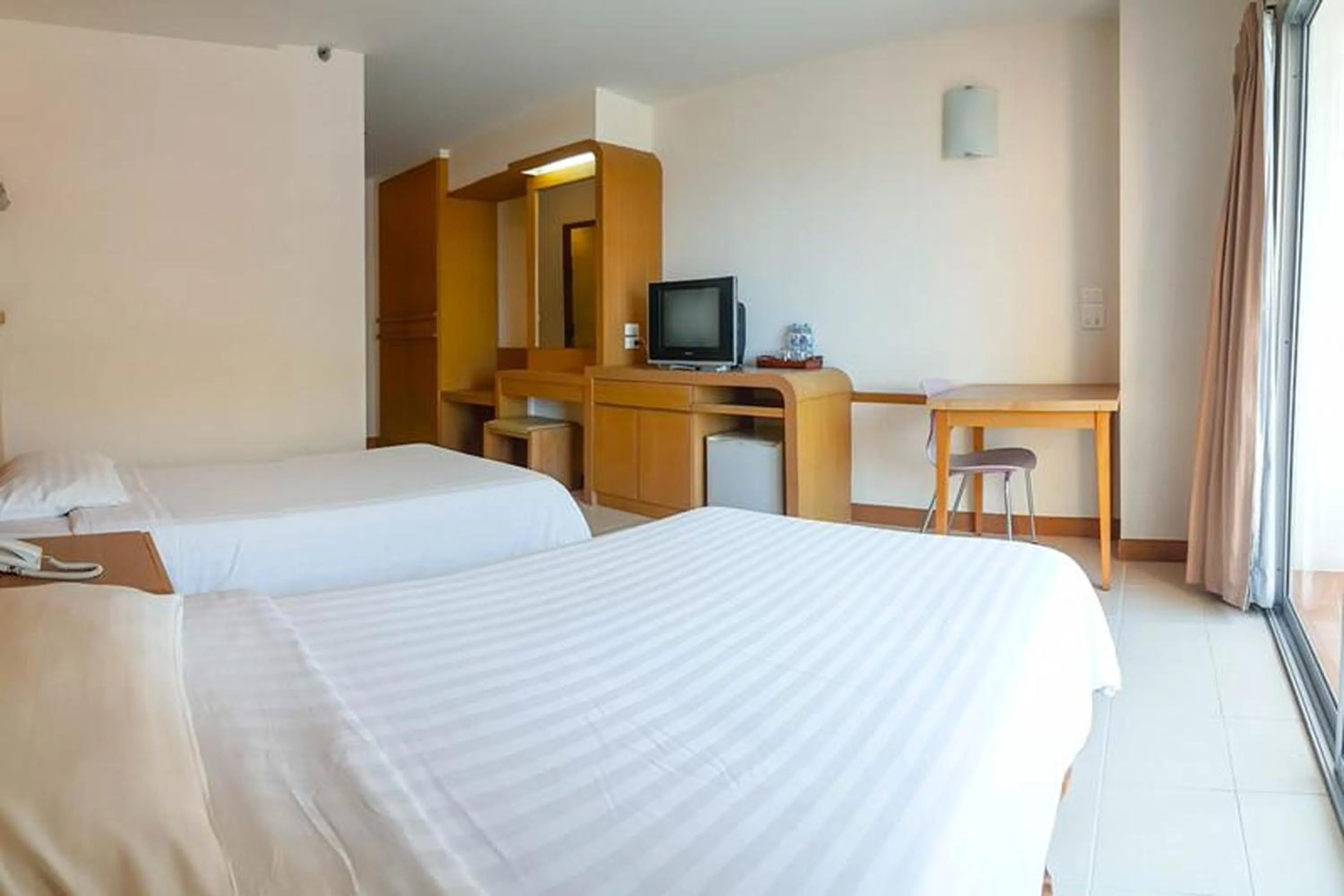 Bed in Eastiny Seven Hotel