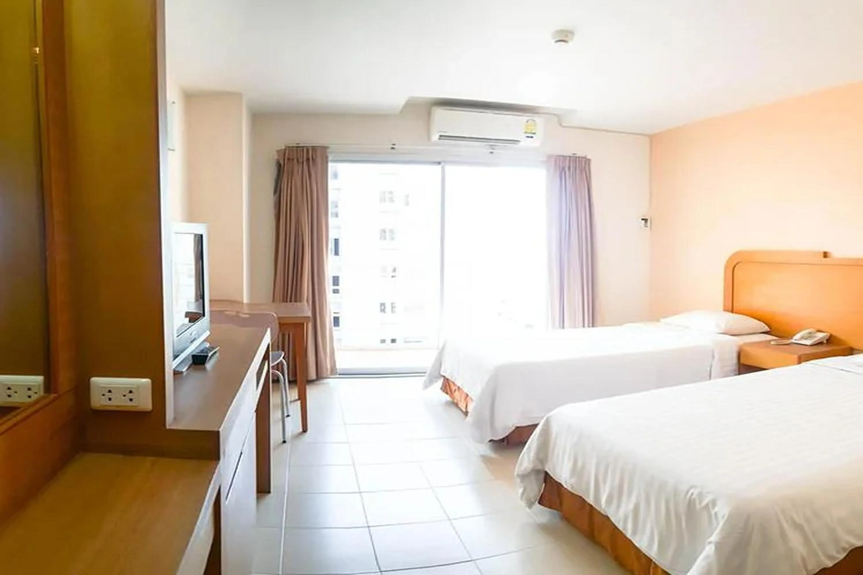 Bed in Eastiny Seven Hotel