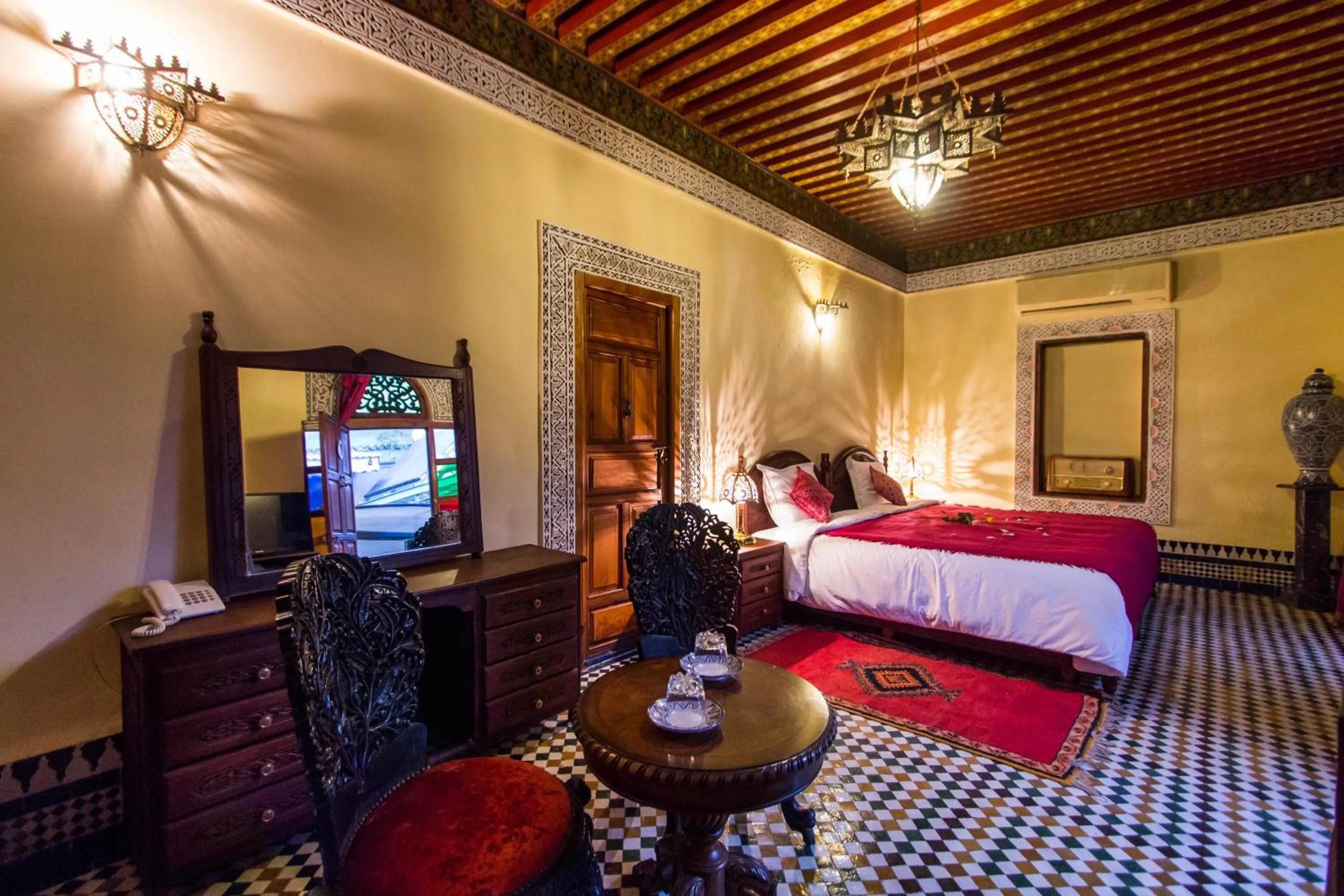 Living room, Bed in Riad Ibn Khaldoun
