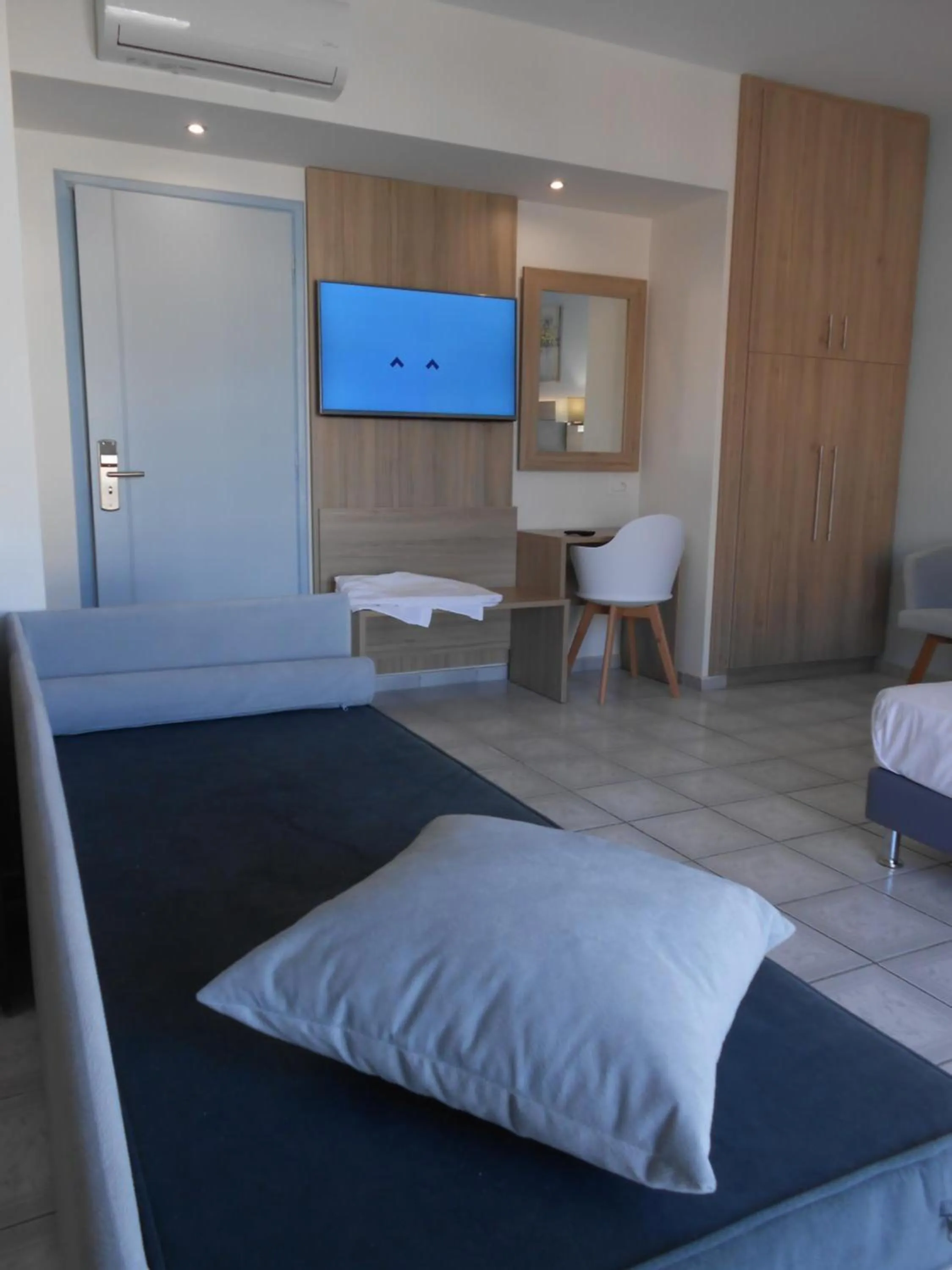 Seating area, Bed in Aristo Apts