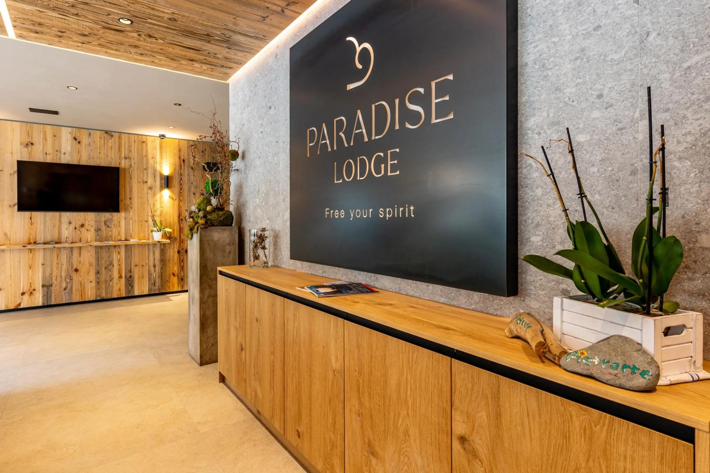 Property logo or sign in Paradise Lodge