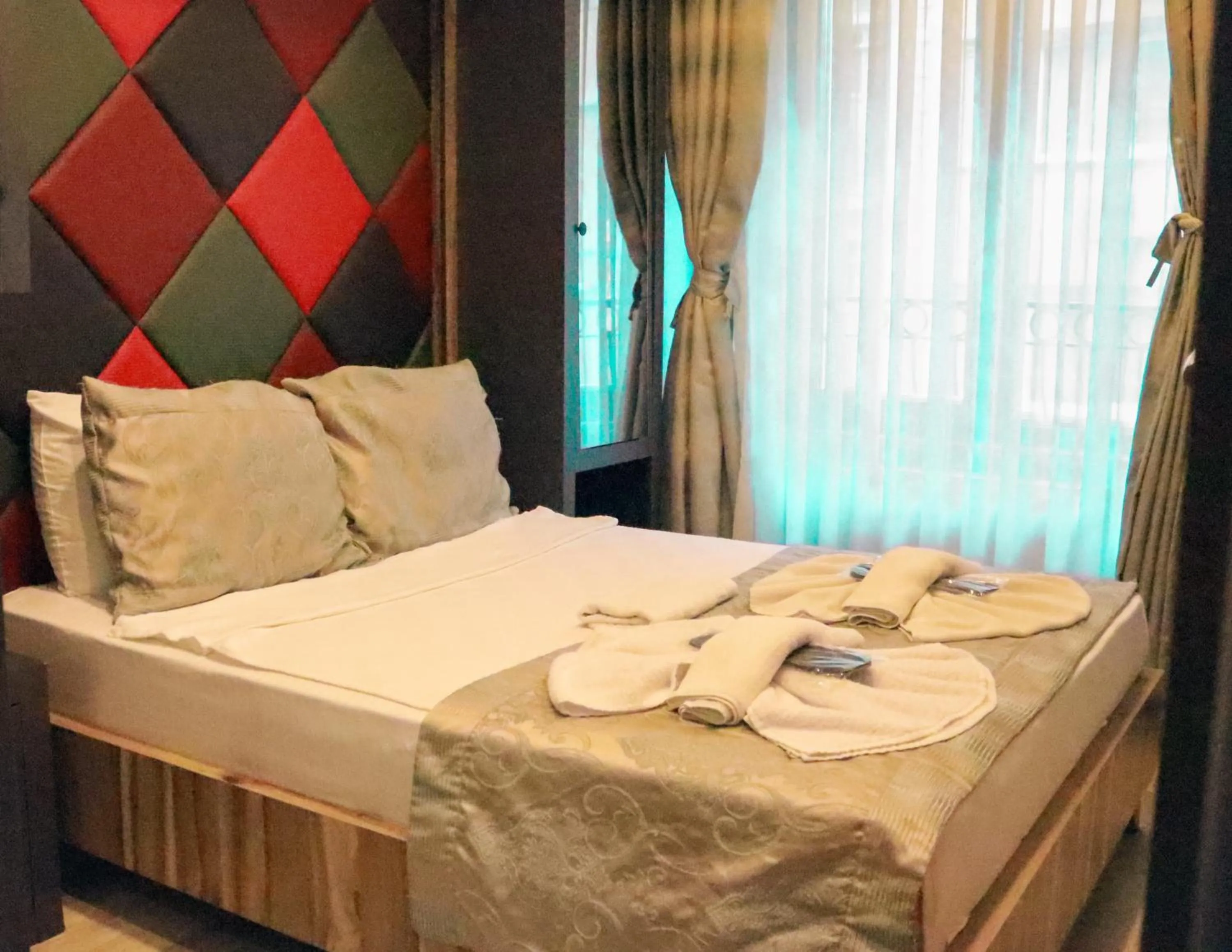 Bed in Grand Esen Hotel