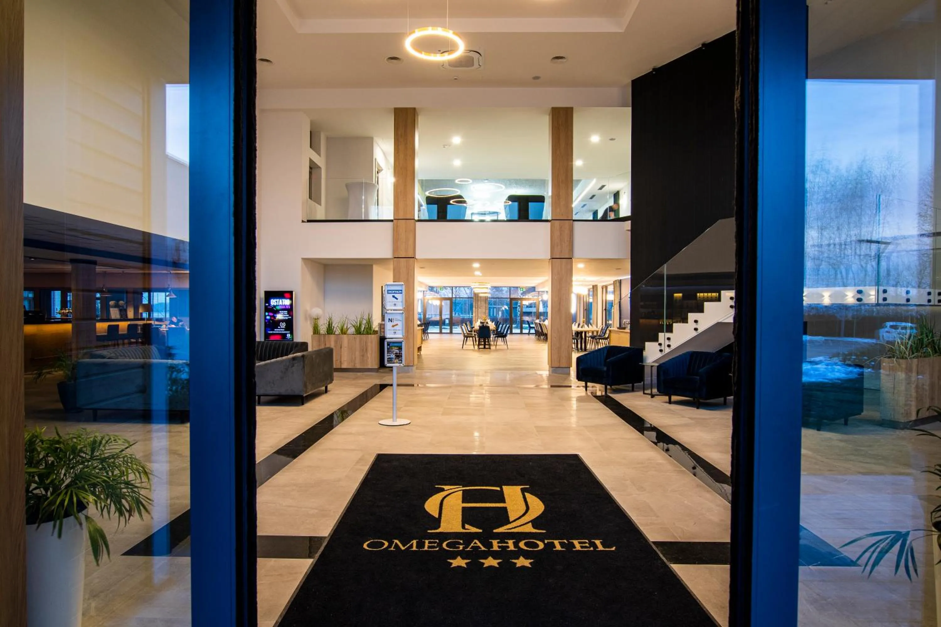 Lobby or reception in Omega Hotel