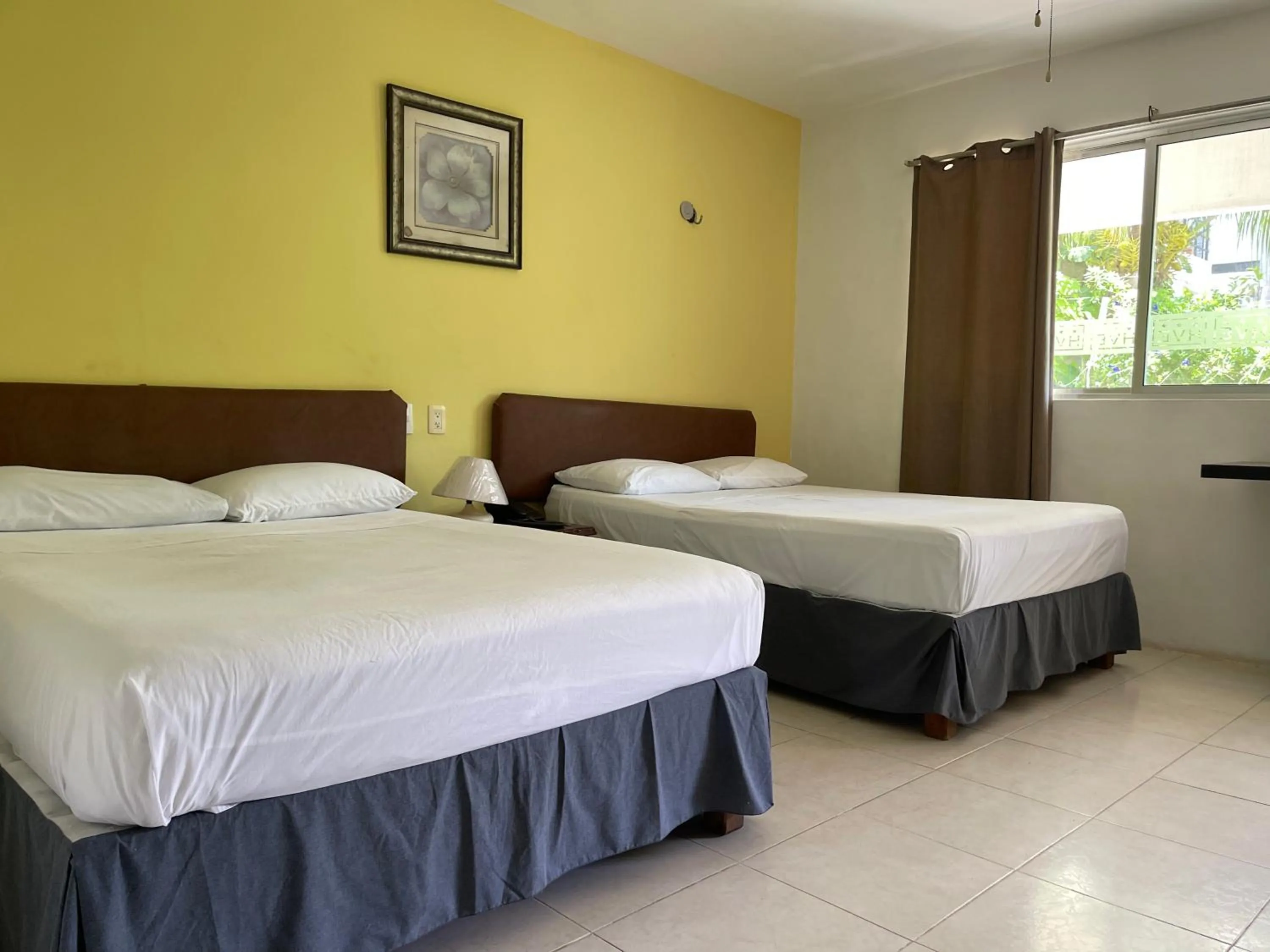 Bed in Hotel Villa Escondida Campeche