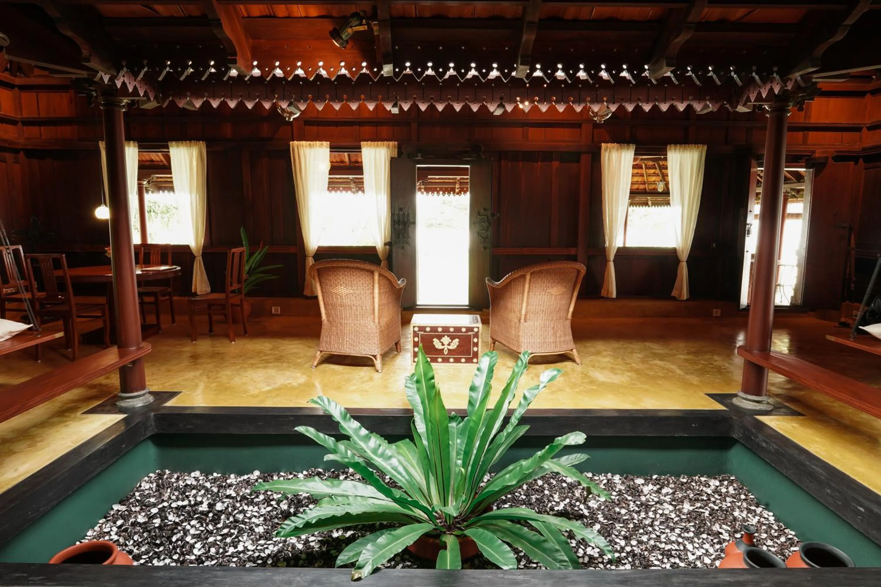 Living room in Vismaya by Moksha Stays