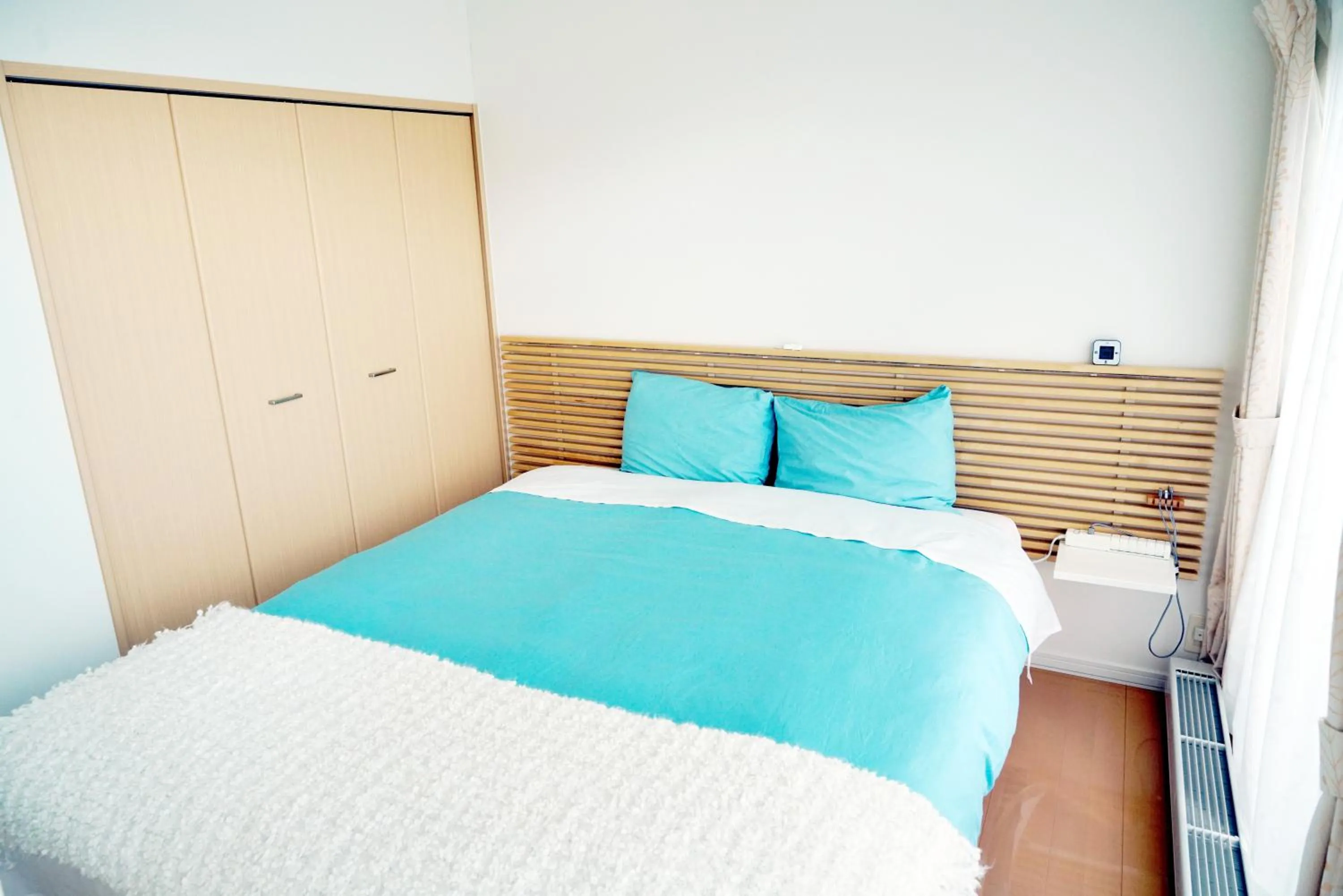 Bed in Villa Sapporo Honobono