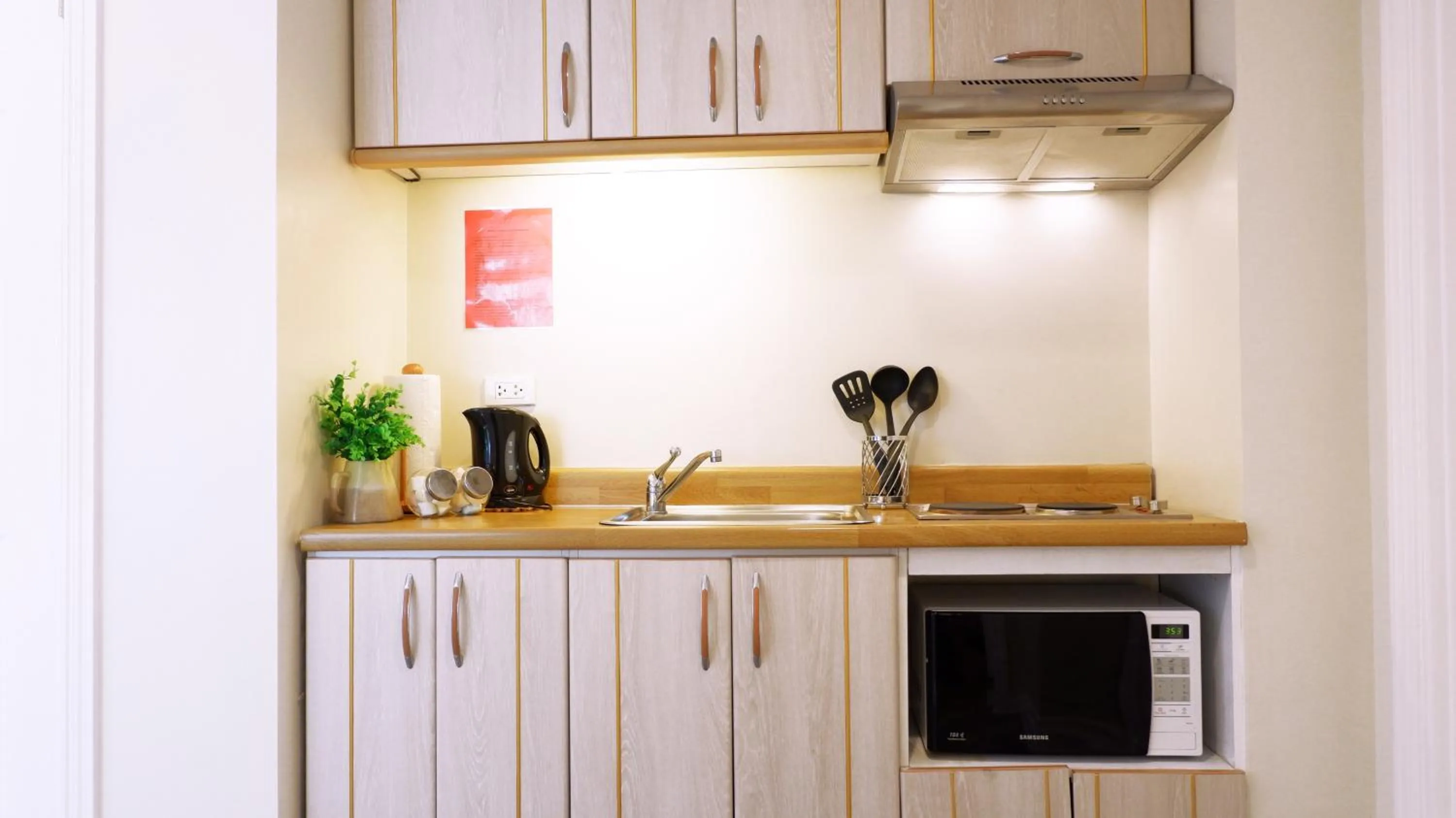 Kitchen or kitchenette in Infinity Tower Suites