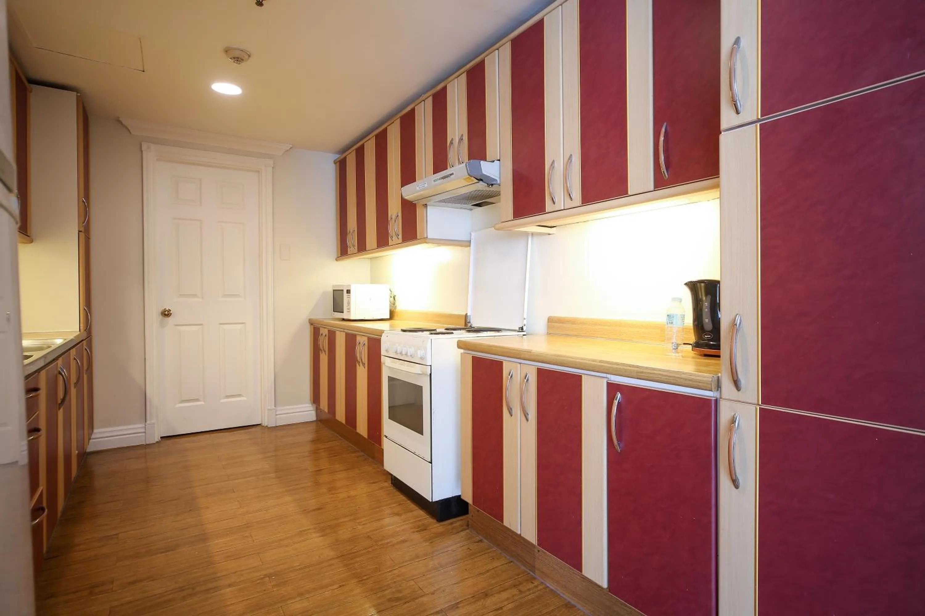 Kitchen or kitchenette in Infinity Tower Suites