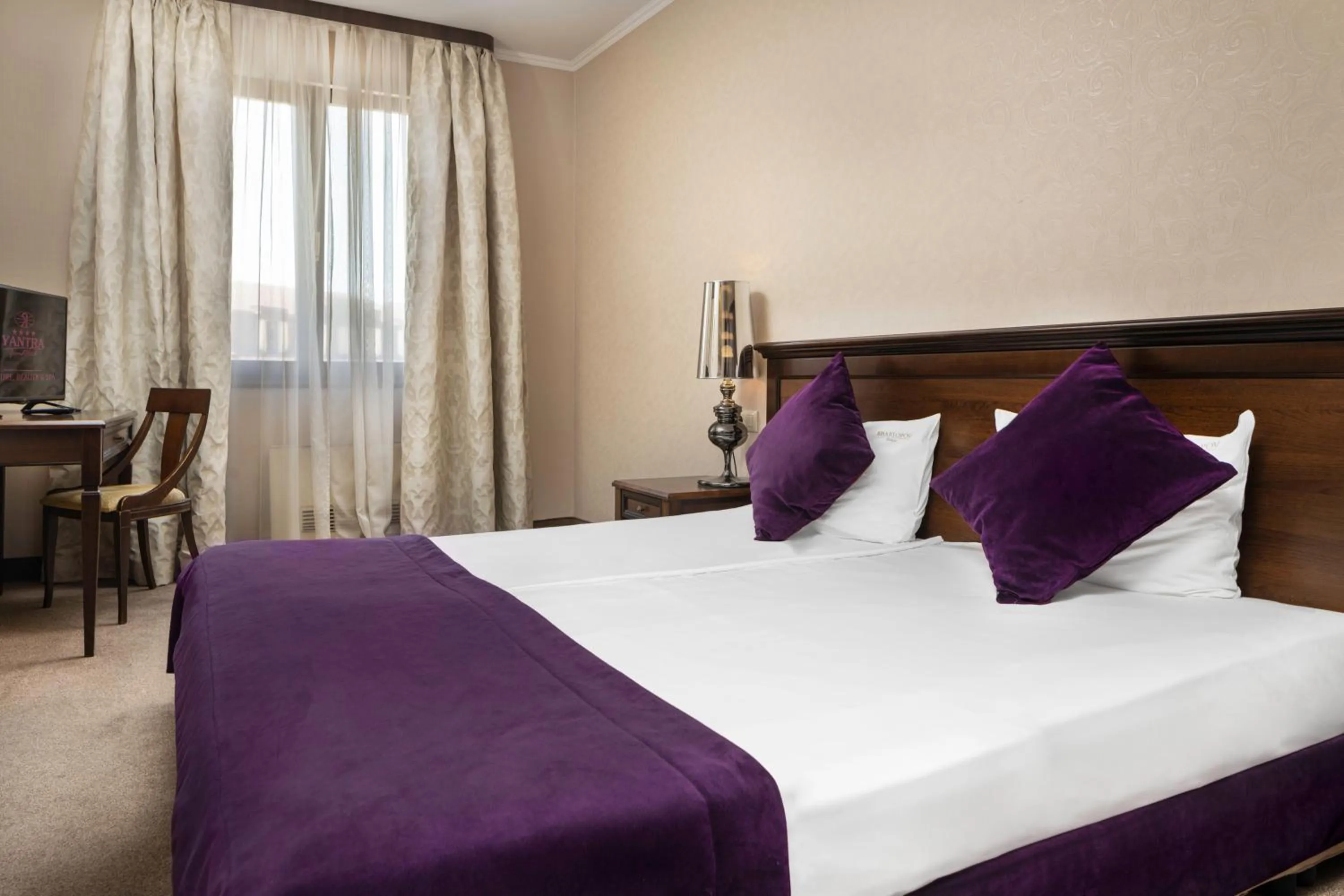 Bed in Yantra Grand Hotel