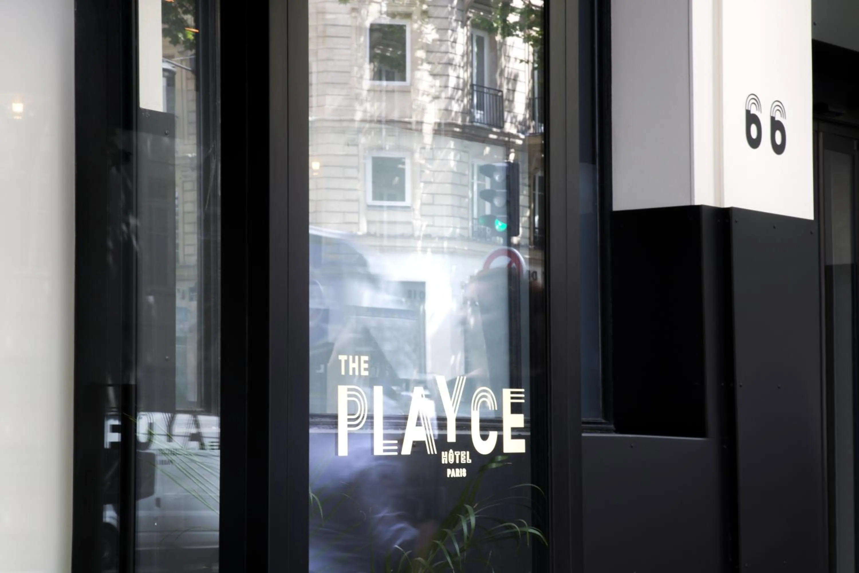 Property logo or sign in Hotel The Playce by Happyculture