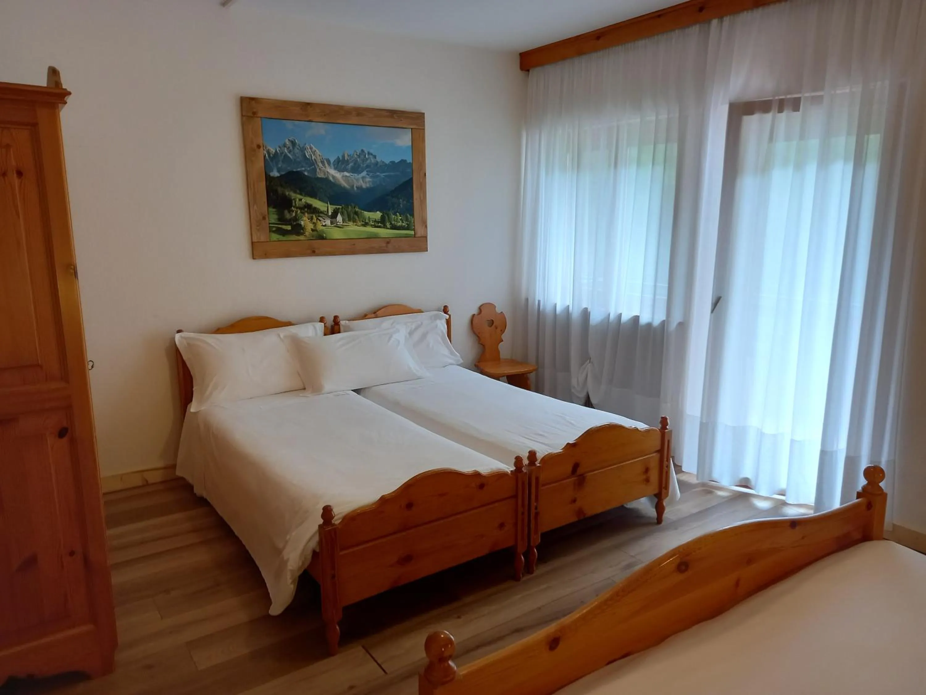 Bed in Albergo Scoiattolo