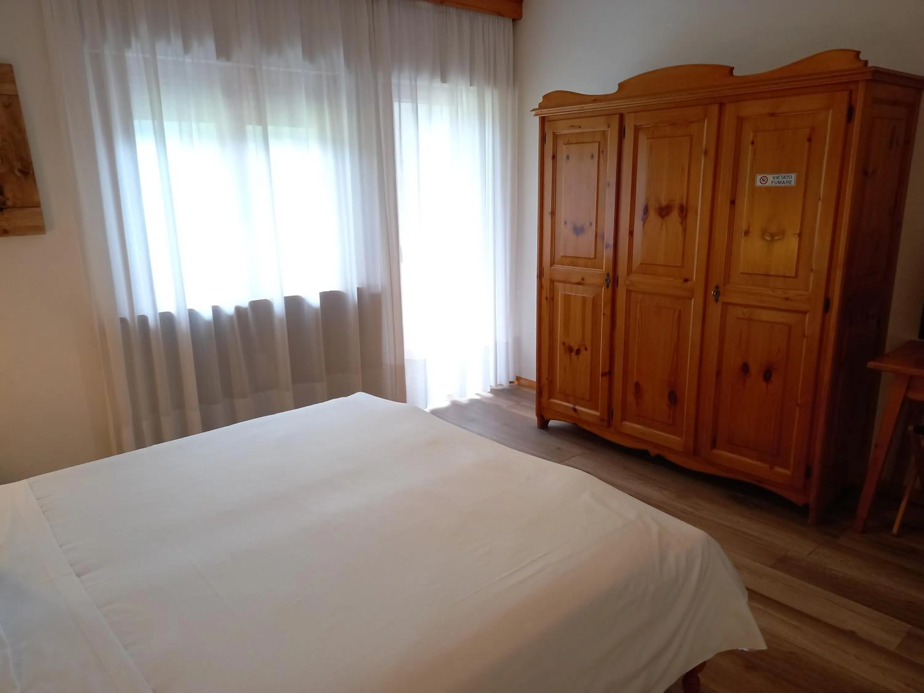 Bed in Albergo Scoiattolo