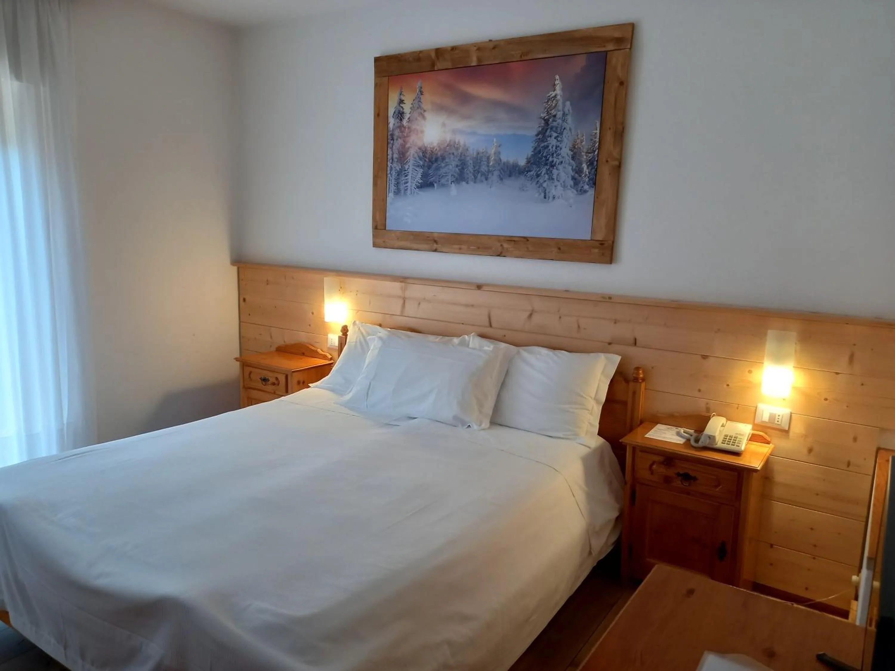 Bed in Albergo Scoiattolo