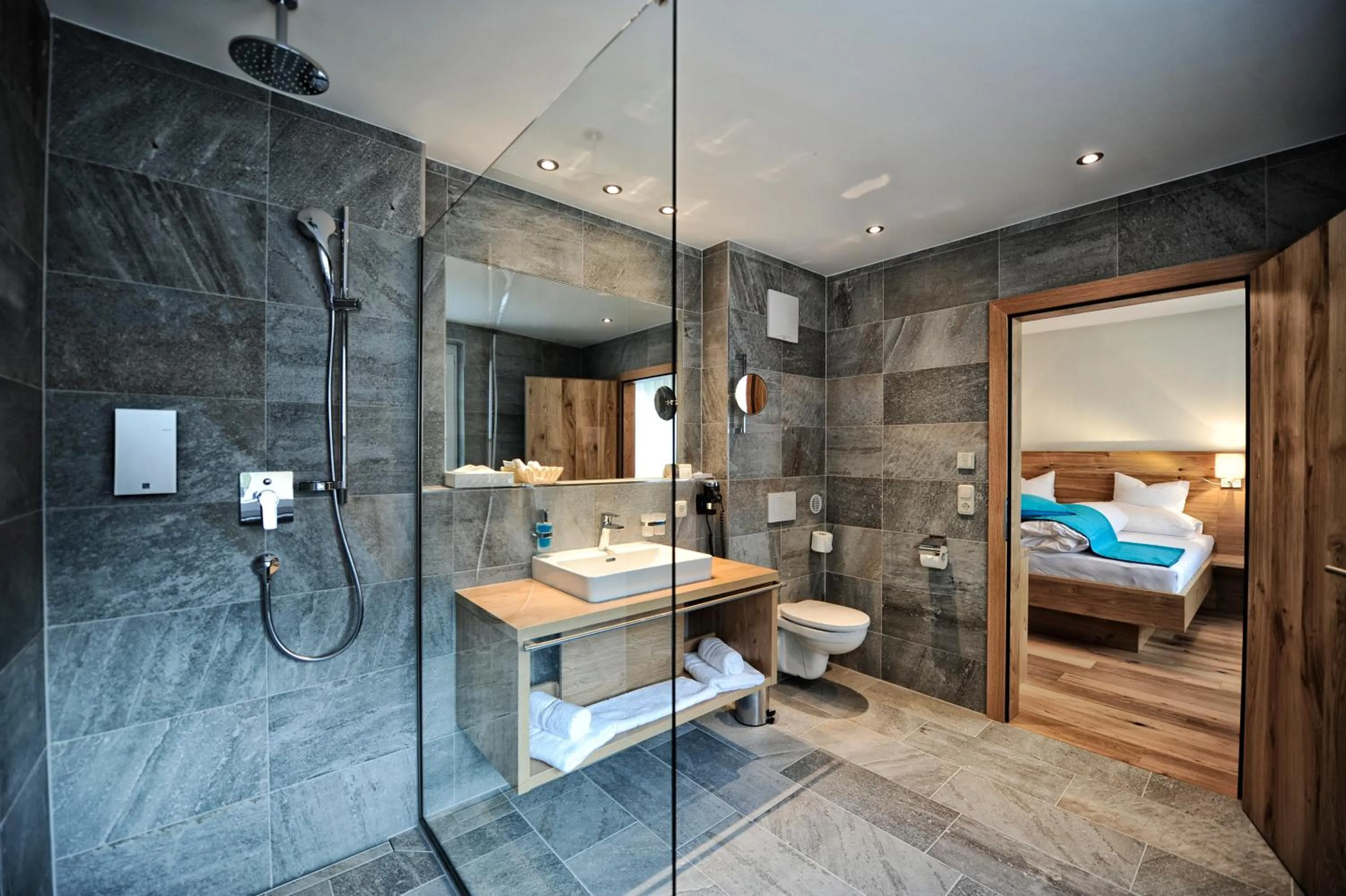 Bathroom, Bed in Hotel Dorfstadl