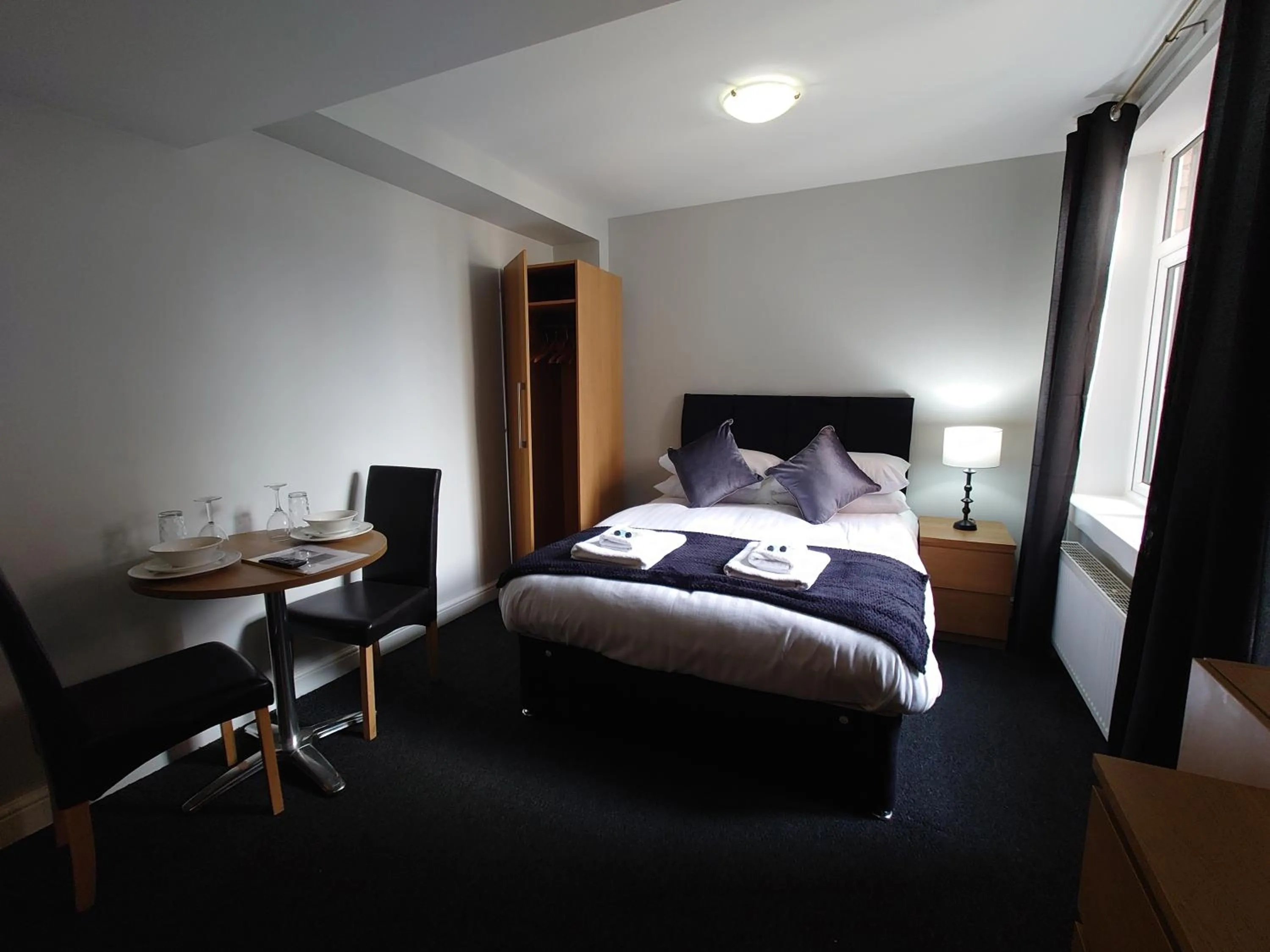 Photo of the whole room in Coasters Holiday Apartments