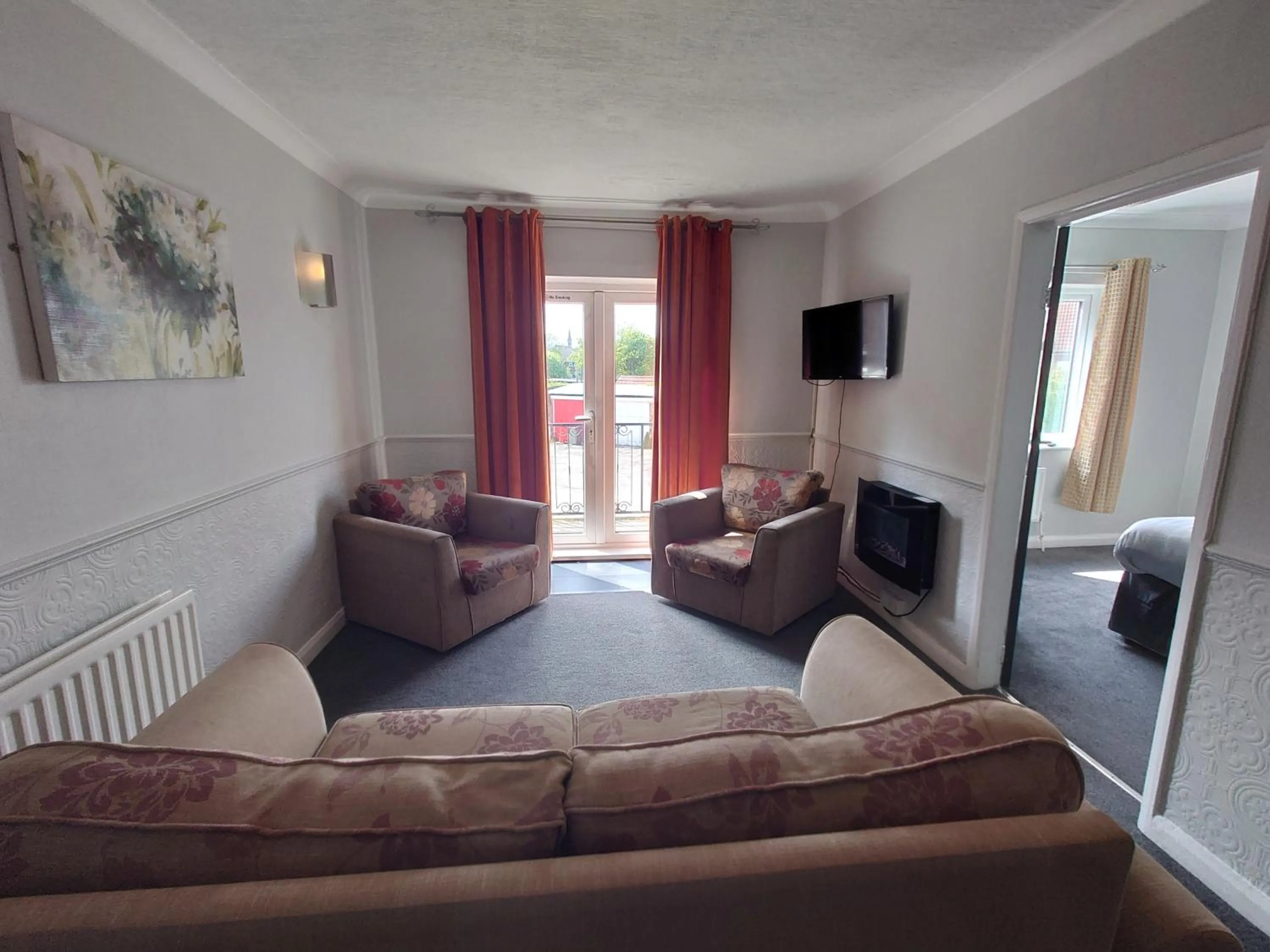 Living room in Coasters Holiday Apartments