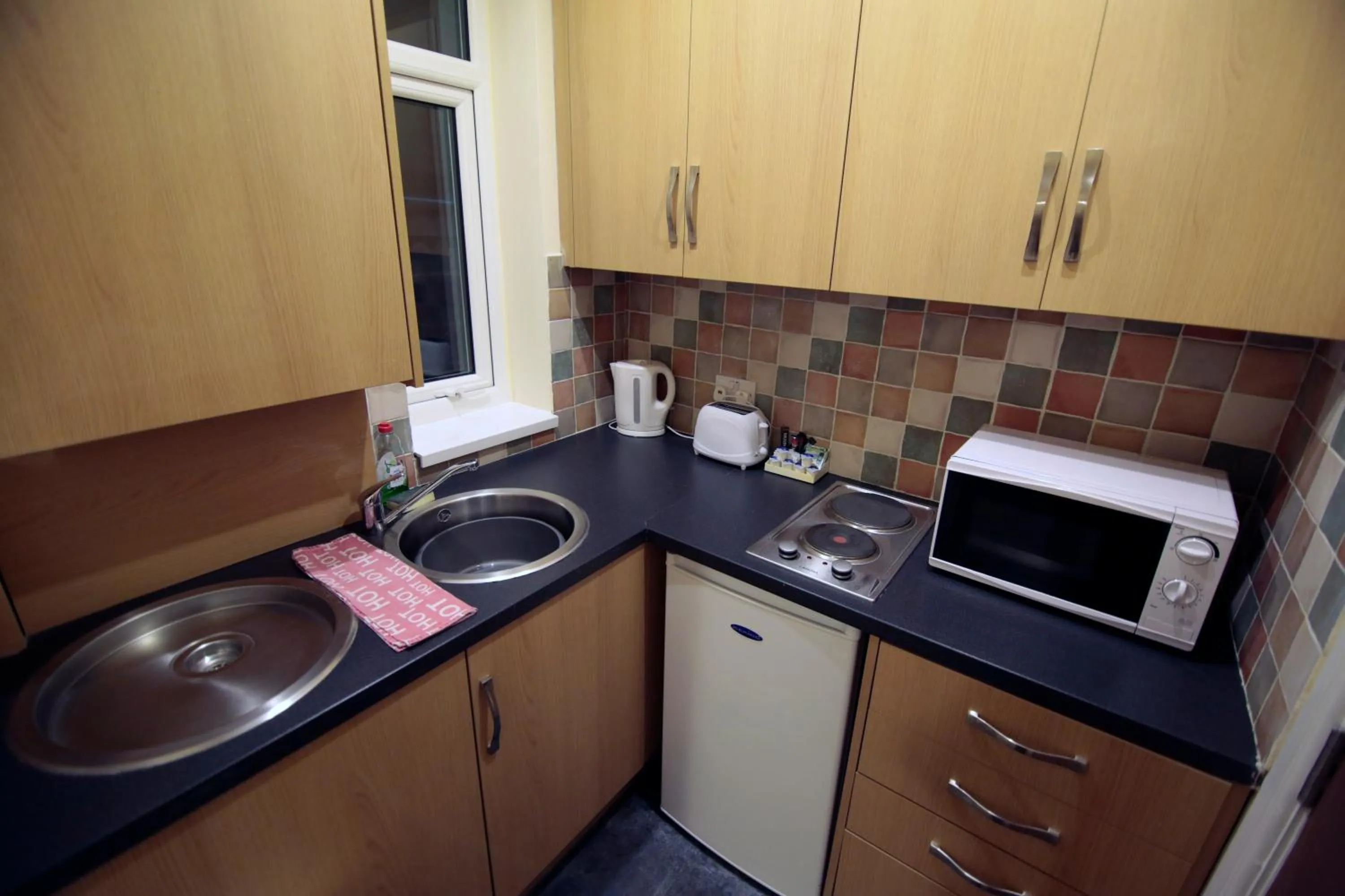 Kitchen or kitchenette in Coasters Holiday Apartments