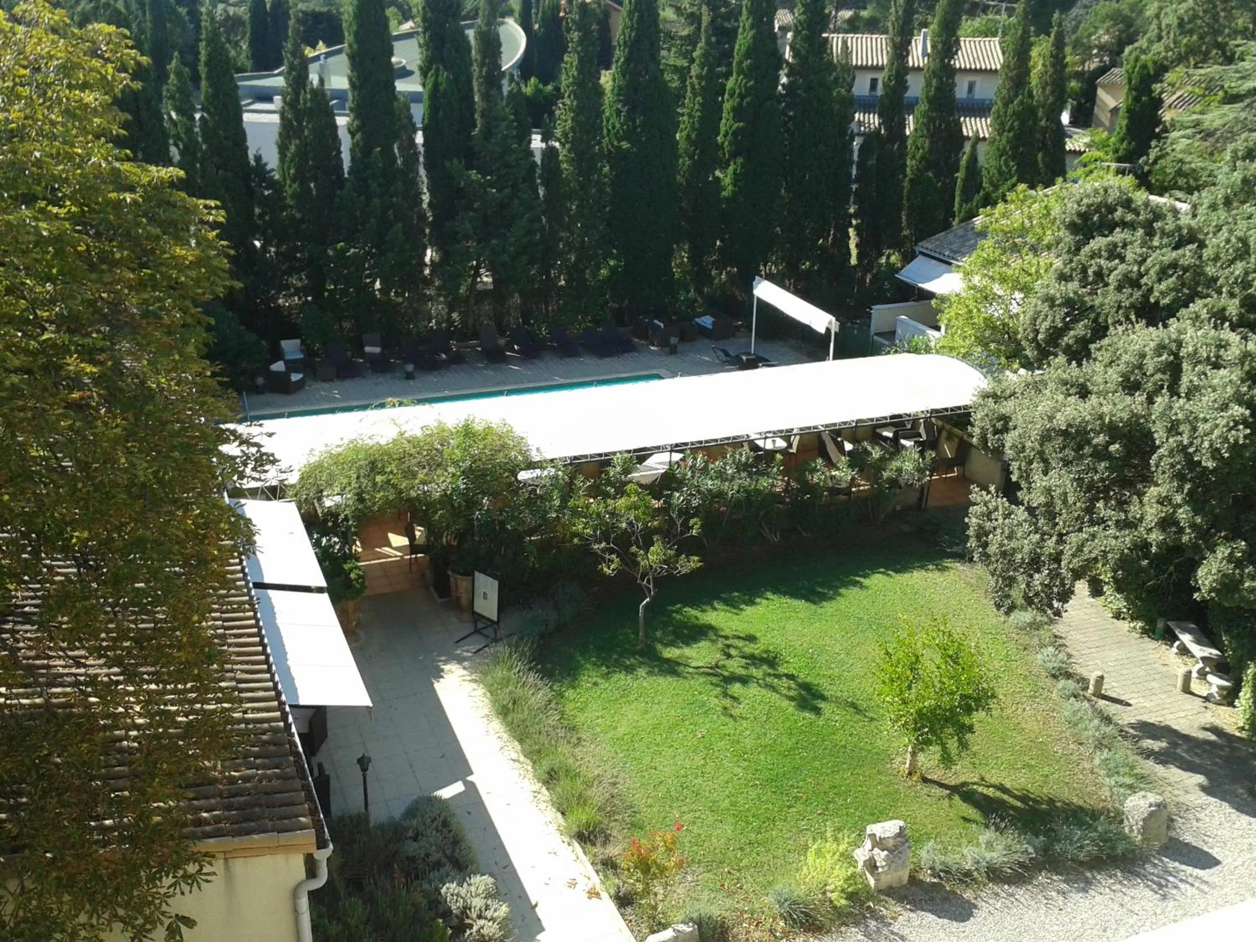 Garden view in Logis Hôtel - Restaurant Résidence Les Cèdres
