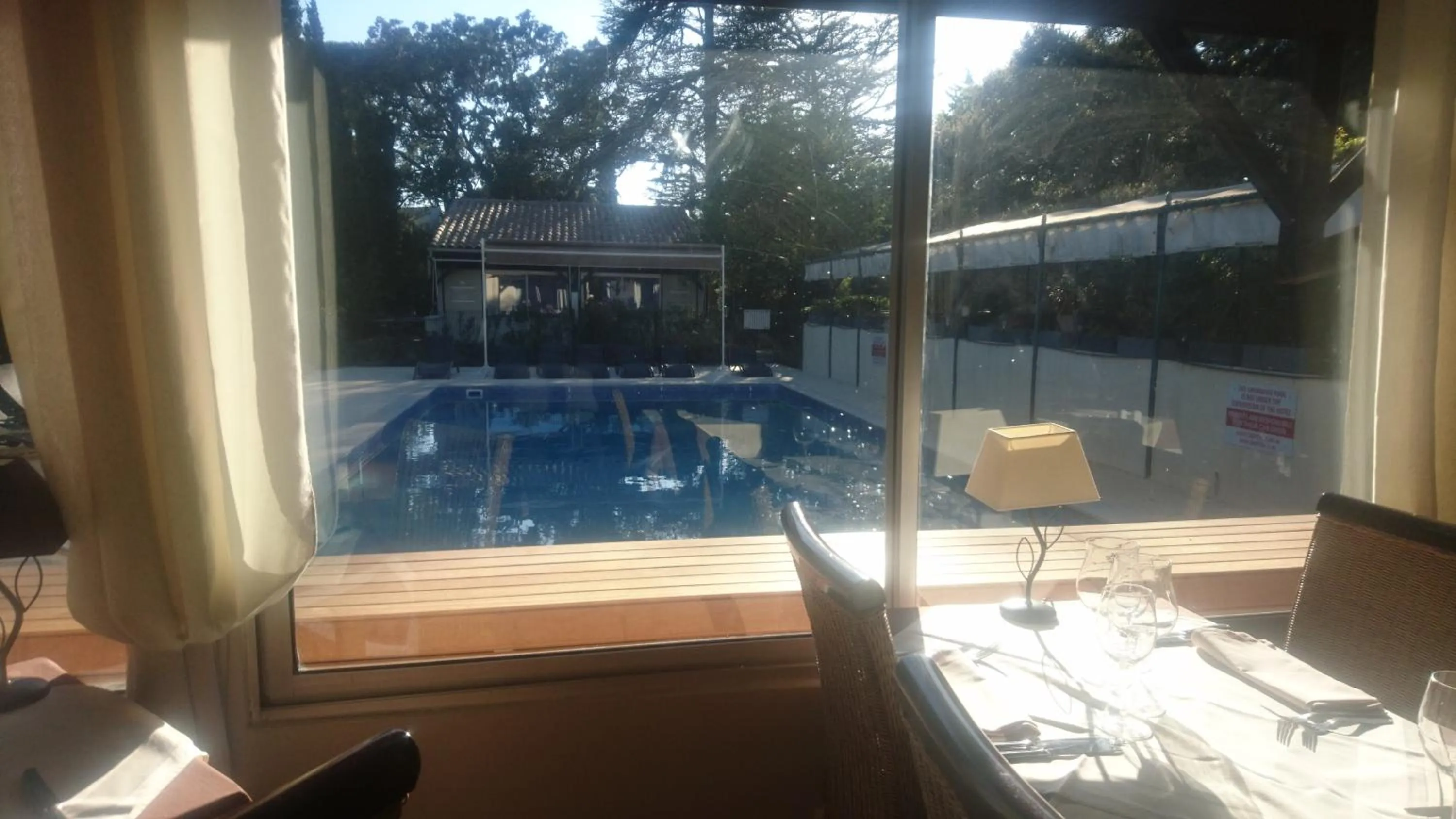 Pool view in Logis Hôtel - Restaurant Résidence Les Cèdres