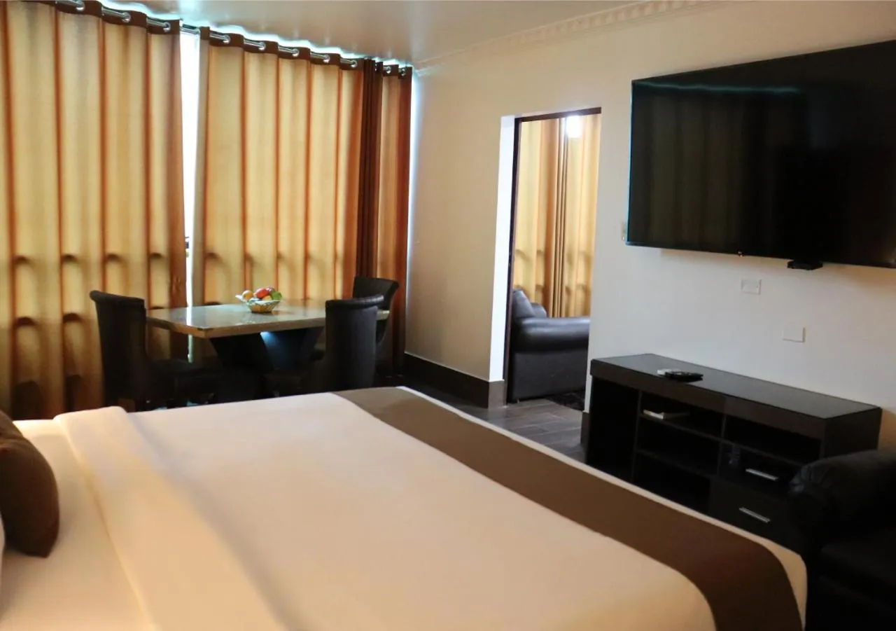 Bed in Inkari Suites Hotel