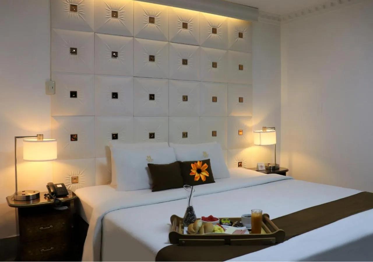 Bed in Inkari Suites Hotel