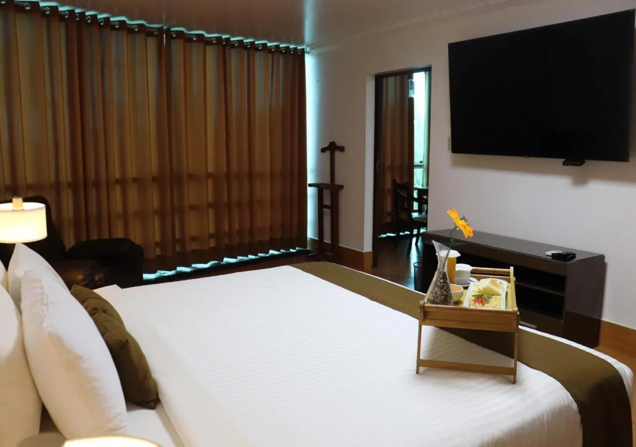Bed in Inkari Suites Hotel