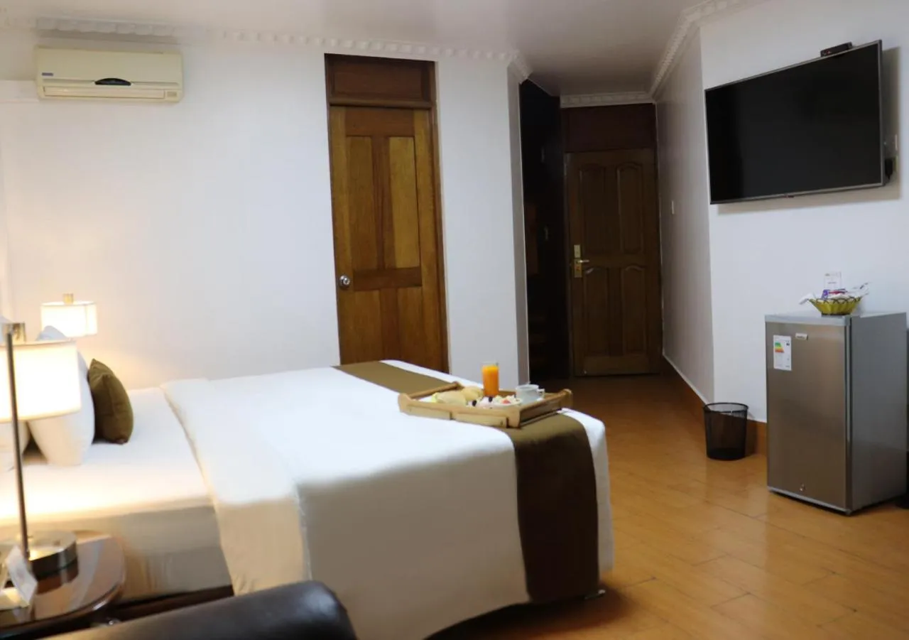 Bed in Inkari Suites Hotel