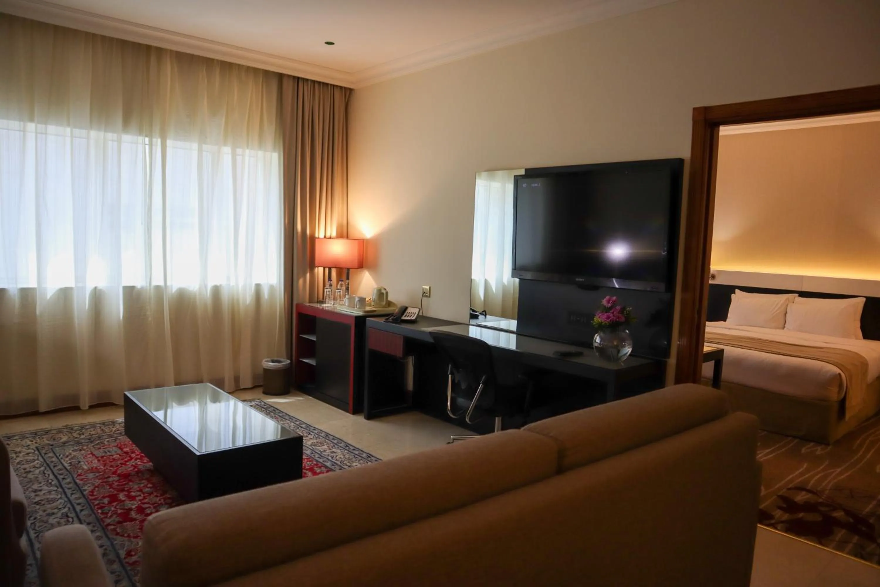 Living room, Bed in Vision Imperial Hotel Formerly Excelsior Hotel Downtown